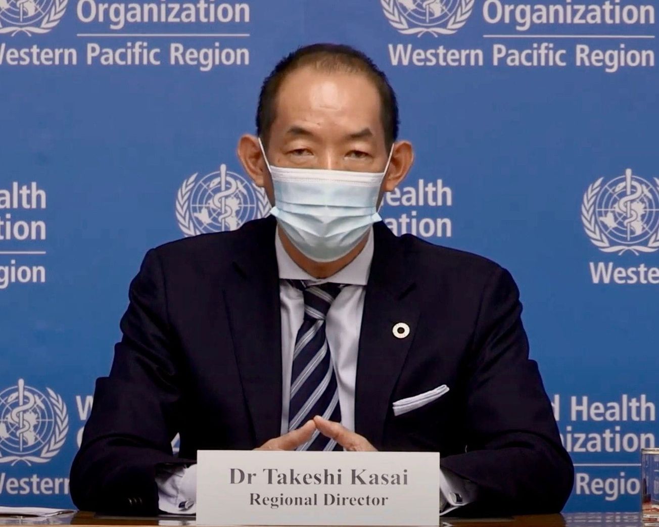 WHO's Western Pacific Regional Director Takeshi Kasai speaks to reporters