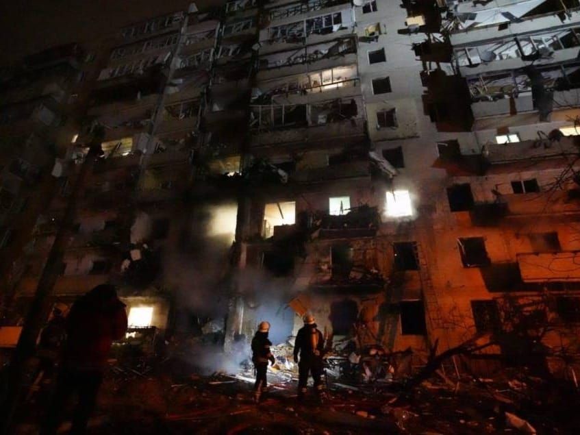 Ukrainian firefighters check damage from a Russian rocket attack in Kyiv