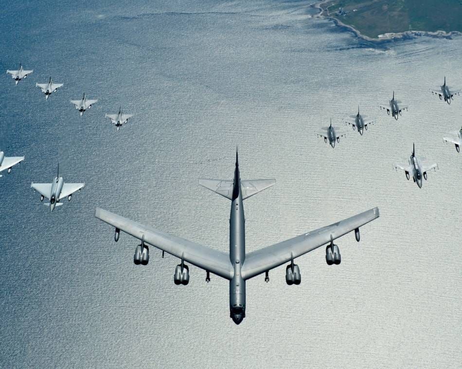 A U.S. Air Force B-52 Stratofortress leads a formation of Polish, German and Swedish aircraft over the Baltic Sea