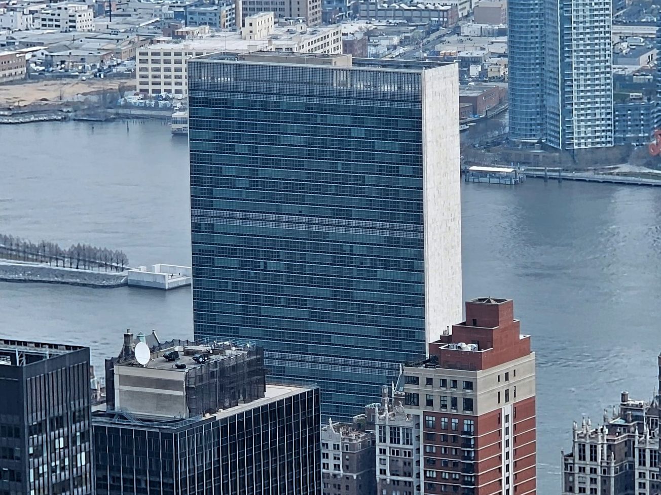 The United Nations Secretariat Building towers above Manhattan's East River.