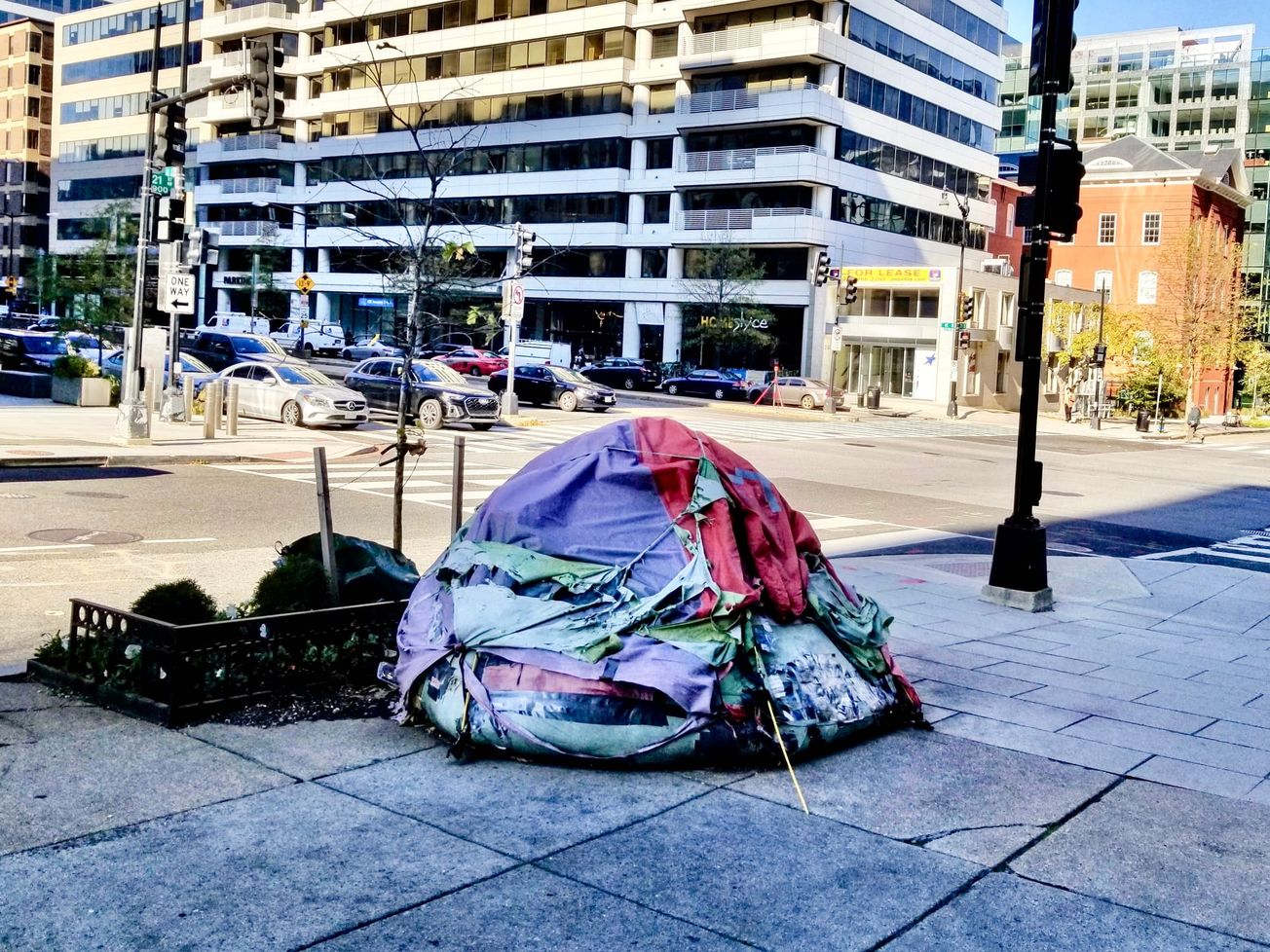 A homeless person's tent at the busy intersection of K Street and 21st St., near lobbyng firms, the IMF and World Bank, in downtown Washington.