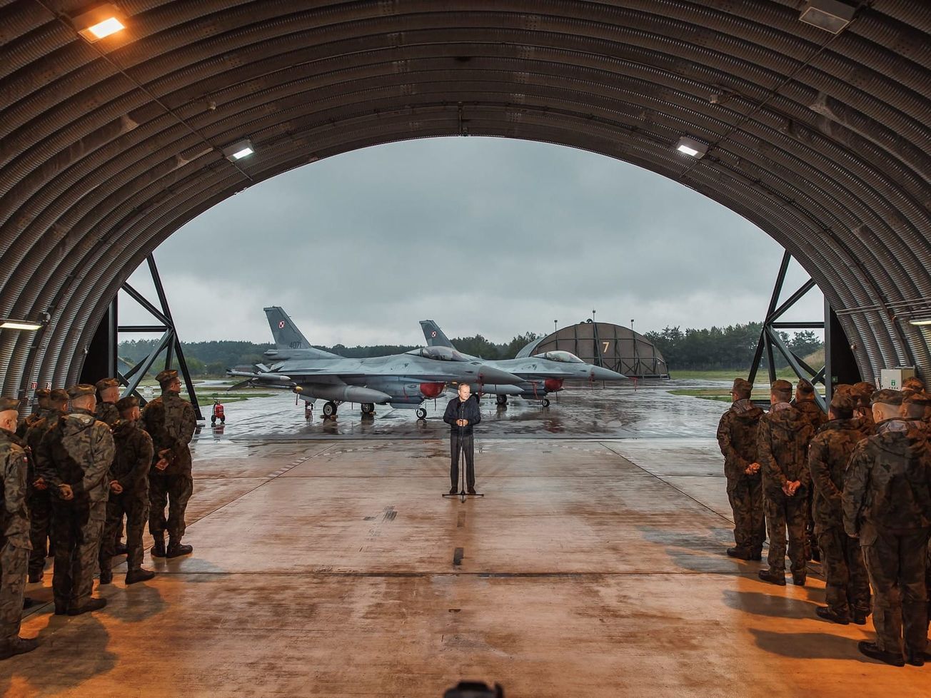 Polish Prime Minister Donald Tusk meets air force personnel at the 32nd Tactical Air Base in Lask, Poland a day after the drone incident. 