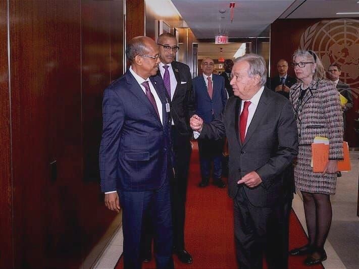 A.U. Commission Chair Mahmoud Ali Youssouf, left, and U.N. Secretary-General António Guterres, center, meet on the sidelines of the U.N. General Assembly. 