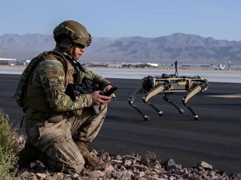 A U.S. Air Force technical sergeant uses a robot equipped with advanced sensors, including thermal and infrared video, combined with AI.