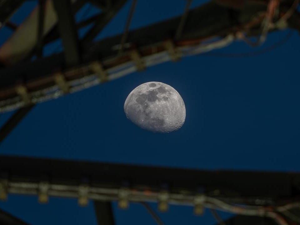 The Moon shines over the Space Launch System and Orion spacecraft atop the mobile launcher at NASA’s Kennedy Space Center in Florida in late January.