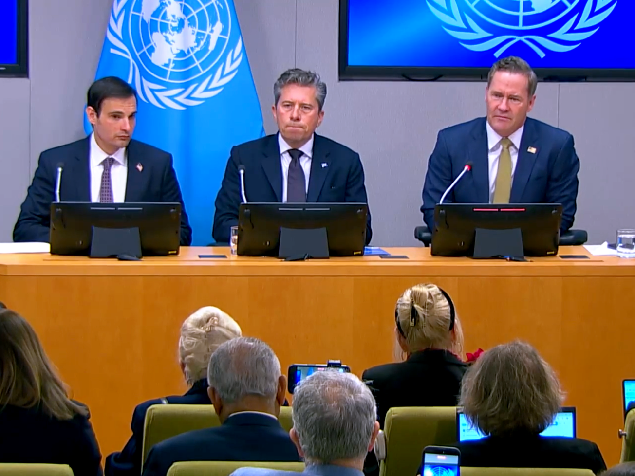 U.N. humanitarian chief Tom Fletcher, center, joins Jeremy Lewin, a U.S. State Department official, left, and U.S. Ambassador to the U.N. Mike Waltz, right, at a press conference.