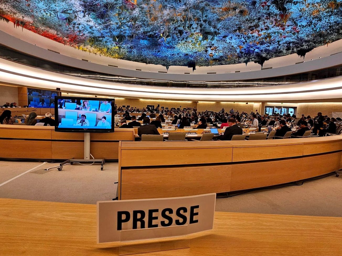Reporting from the press gallery at the United Nations Human Rights Council in Geneva.