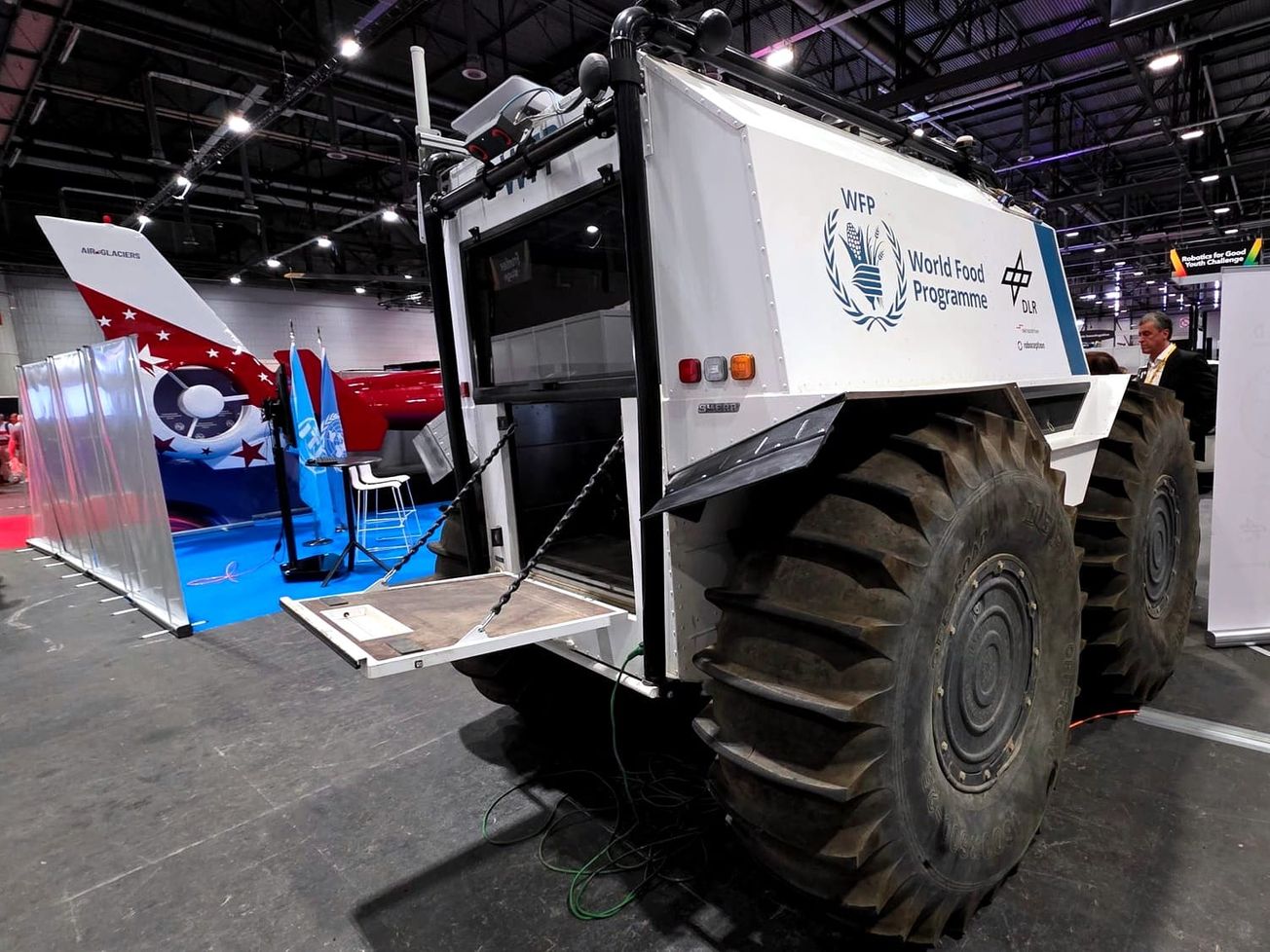 The World Food Program and the German Aerospace Center use AI-enabled, amphibious all-terrain vehicles to deliver food in dangerous disaster zones. 