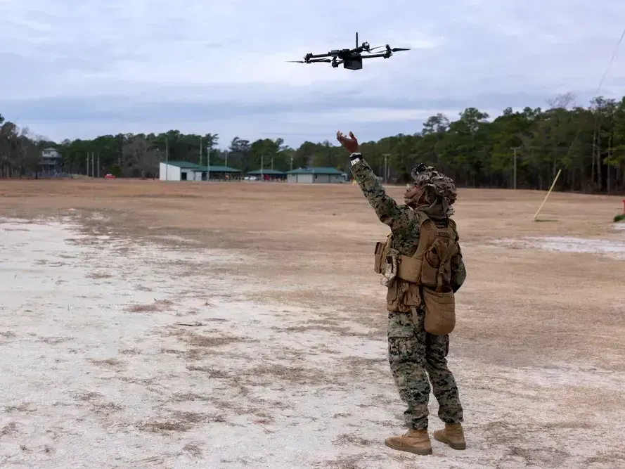 A U.S. Marine Corps lance corporal and rifleman flies an unmanned aircraft system at Camp Lejeune, North Carolina, on Jan. 17, 2023.