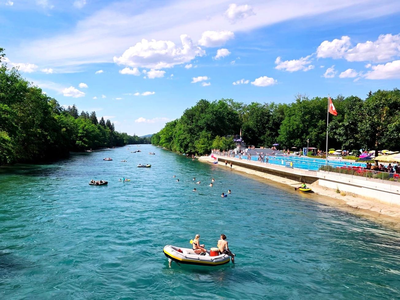 People escape fron the heat in summer along the Aare River in Münsingen, Switzerland.