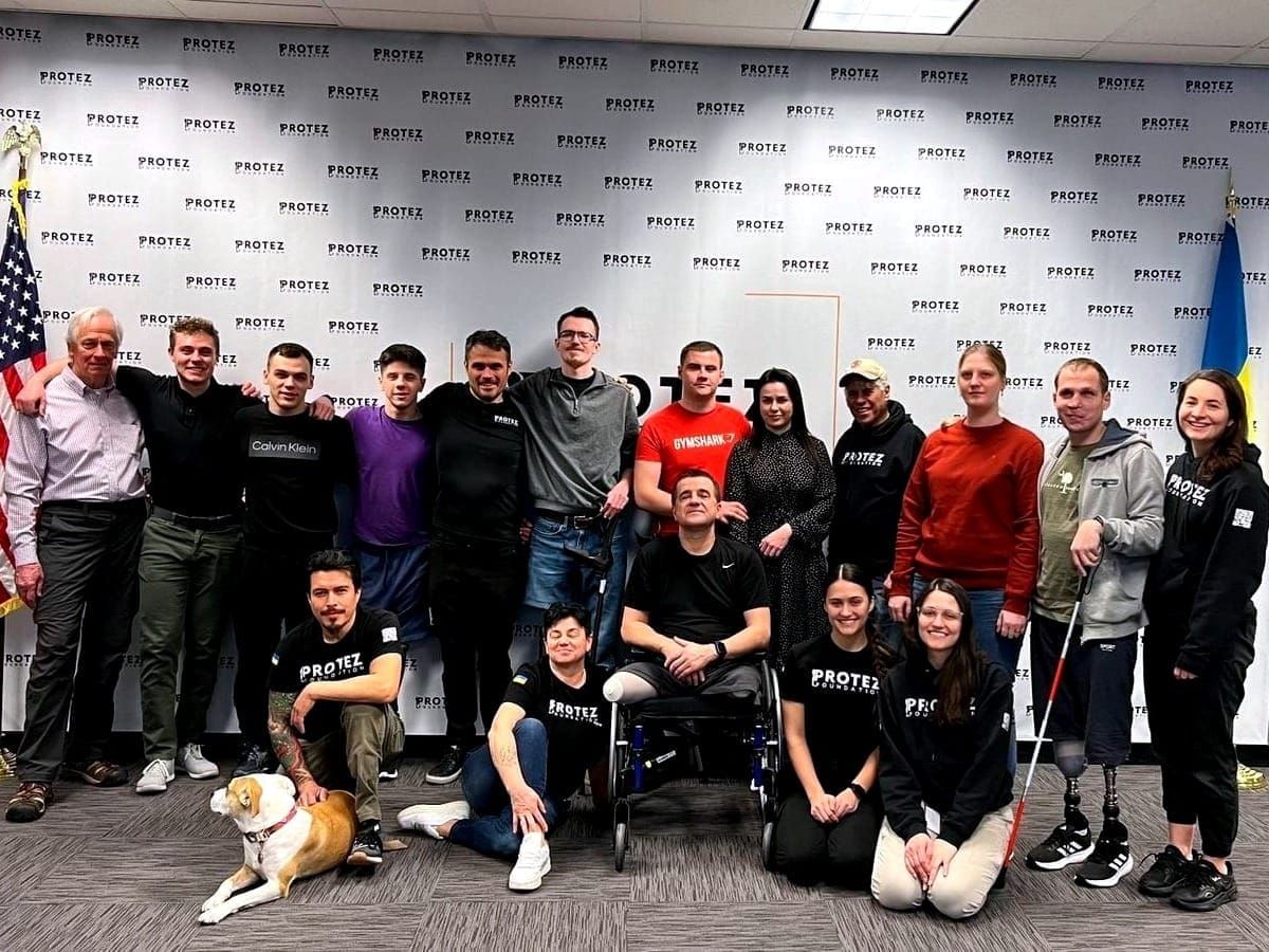 Eric Jorgenson with other prosthetic recipients at the Protez Foundation's U.S. headquarters in Oakdale, Minn. 