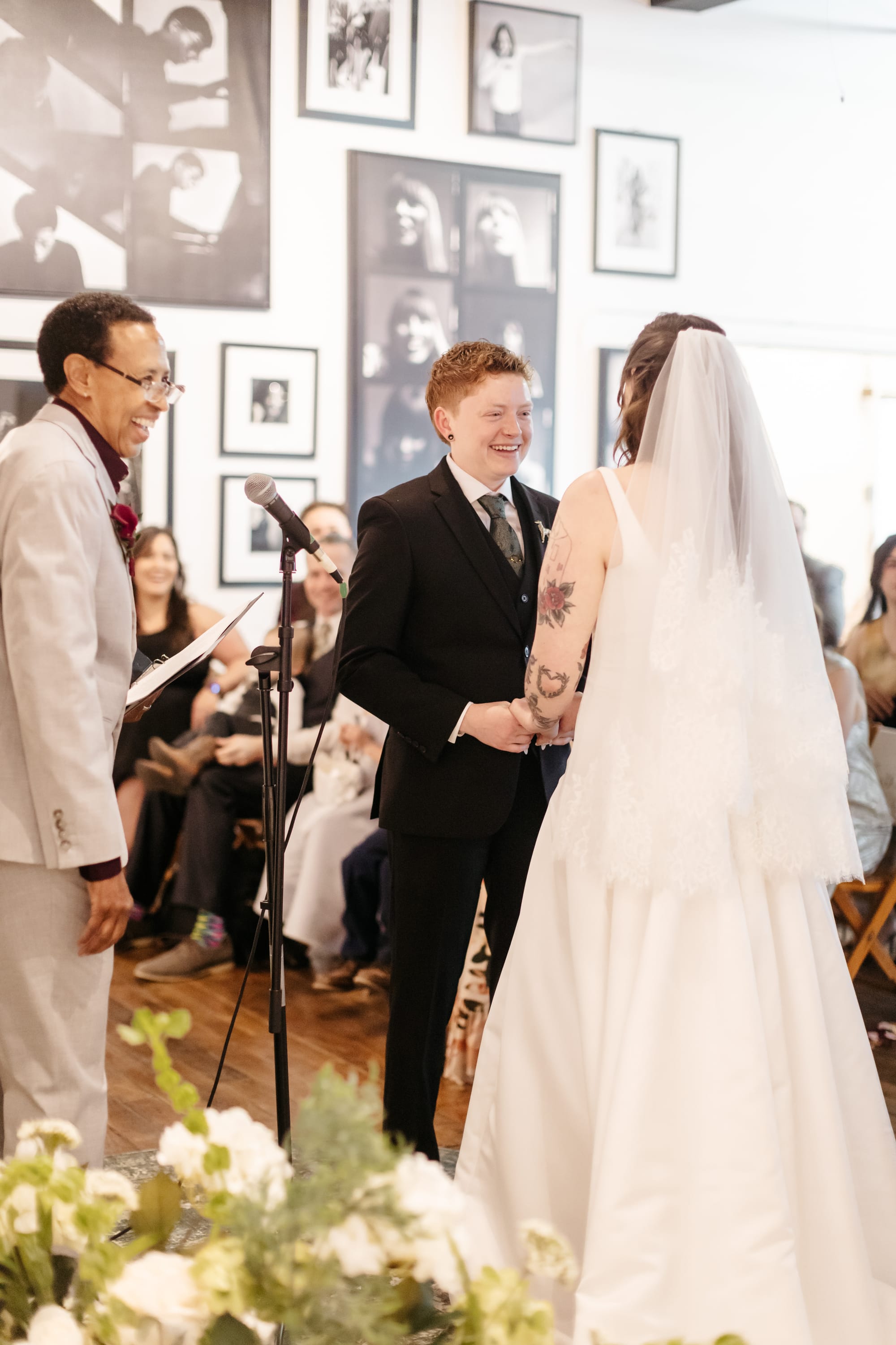 Jill of Jillori laughing with Lauren and Sage Castleberry during their wedding ceremony