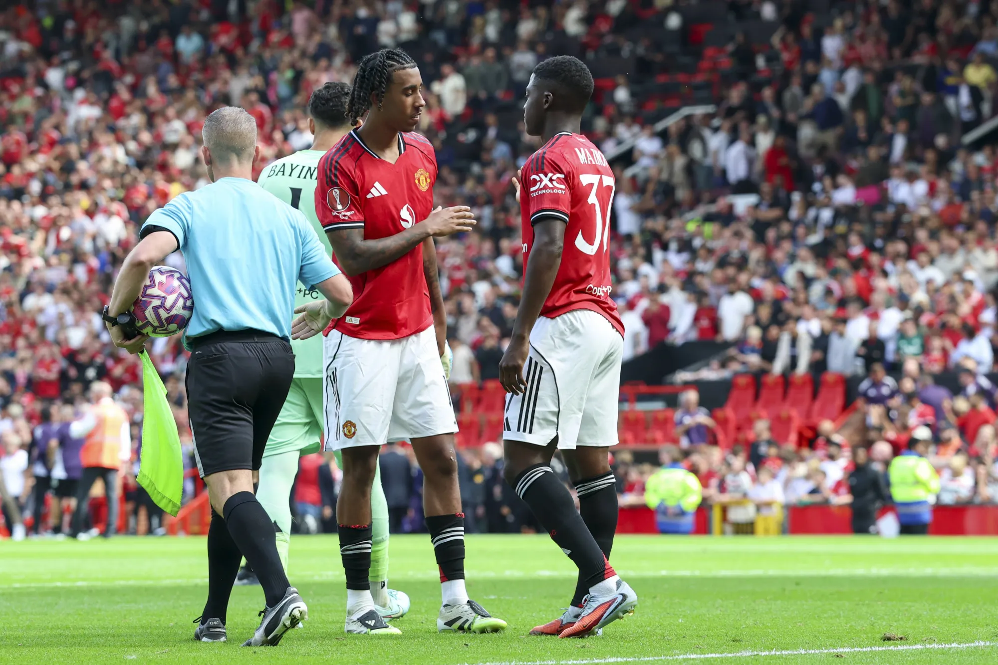 Leny Yoro and Kobbie Mainoo in action for Manchester United against Fiorentina in a pre-season clash at Old Trafford