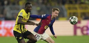 Hansi Flick eye's Borussia Dortmund striker Serhou Guirassy