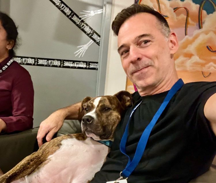 My dog, Scooby, and me sitting in a chair.