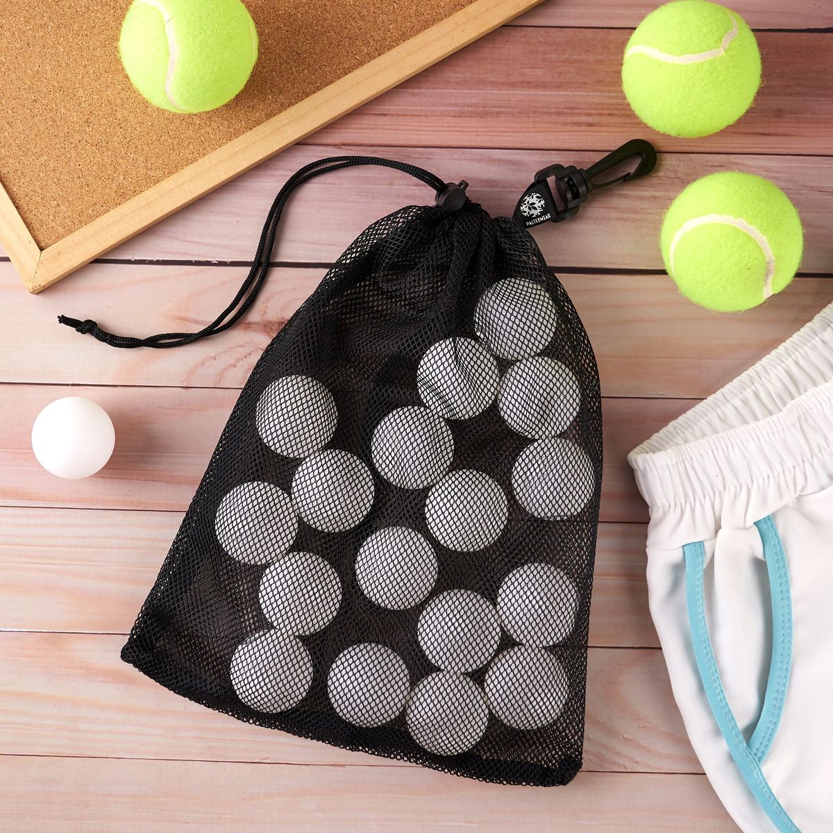 A mesh bag filled with ping-pong balls on a wooden table