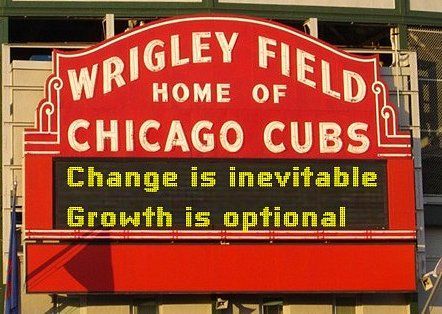 Wrigley Field marquee, old school white font on red background.  LED sign says, "Change is inevitable/Growth is optional"