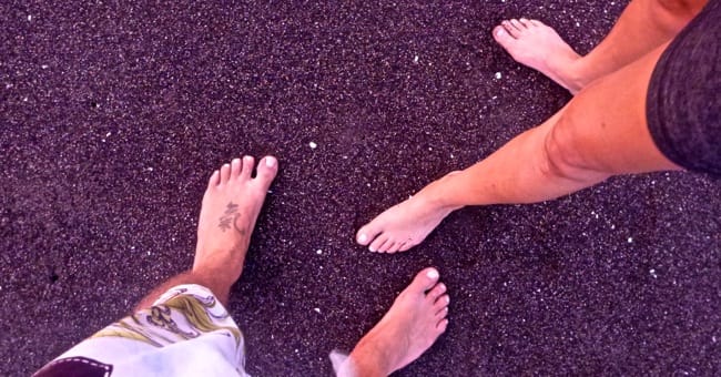 toes in black sand