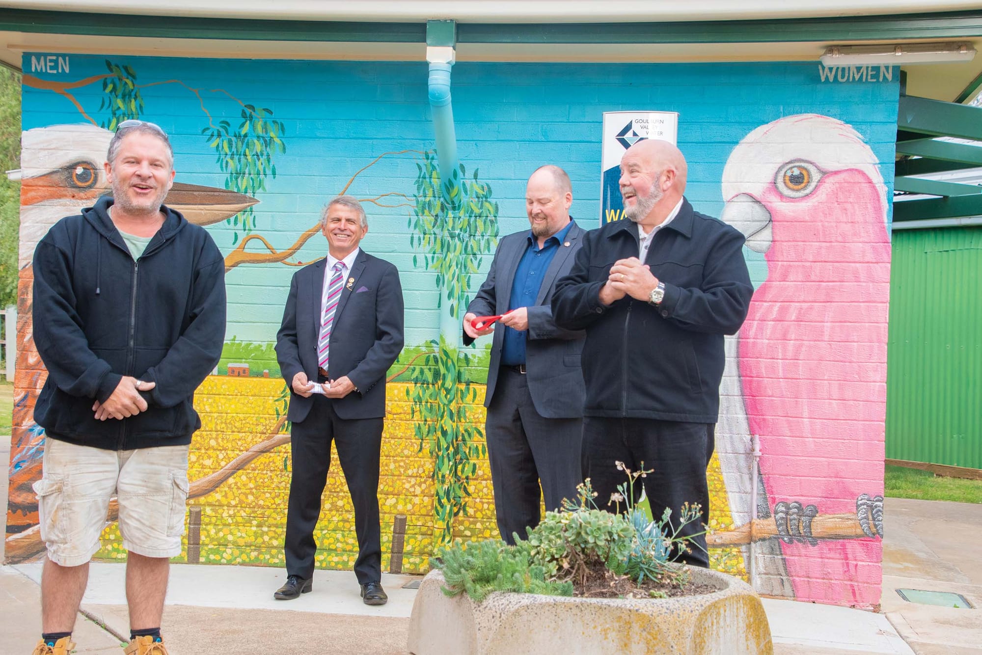Bright idea ... Artist Tank (far left) used the occasion to advocate for a different type of art trail. Also pictured (left to right): Moira Shire Mayor Libro Mustica, Katamatite Primary School principal Jason Whiteley and Katamatite Community Action Group president Mark Nordbye.
