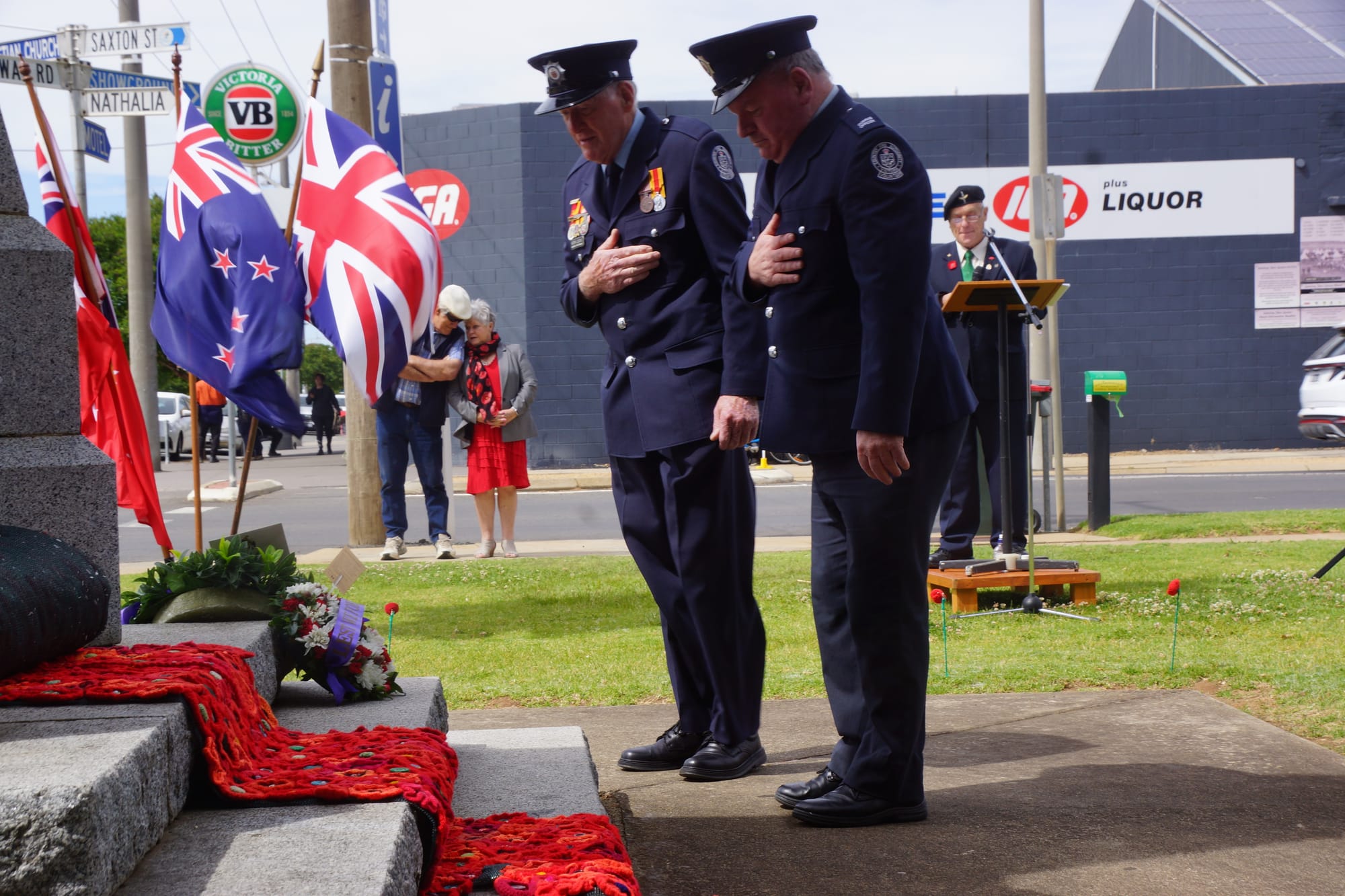 Paying their respects... Fire brigade members John Shrimpton and Kevin Lucas lay a wreath on behalf of Numurkah CFA. 
