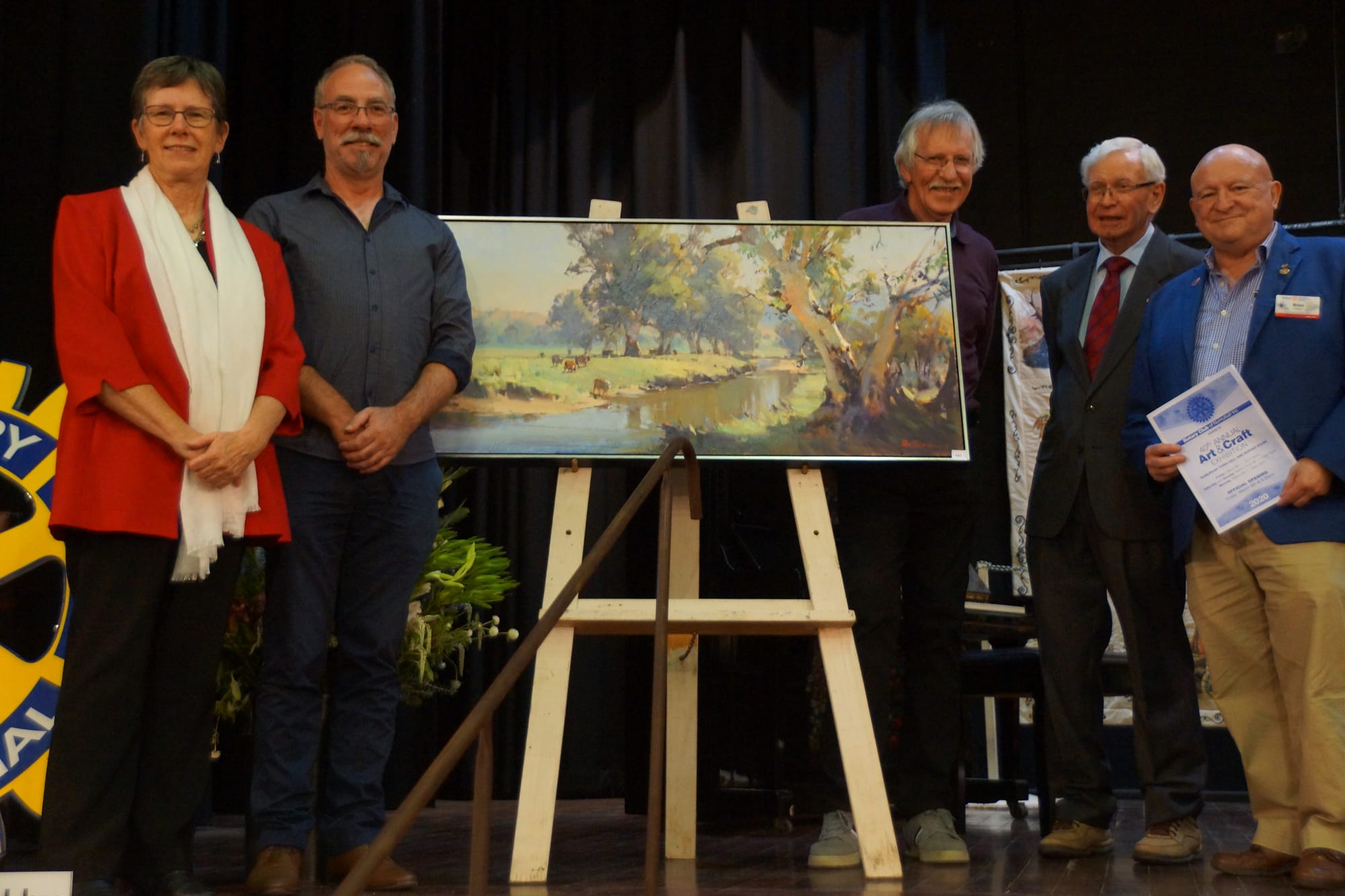 Best in Show ... Rotary Club of Numurkah president Lorraine Greenwood, art judge Ben Winspear, winning artist Ross Paterson, Lou Hamon and Rotary district governor Brian Peters with the overall winner Tumut River.