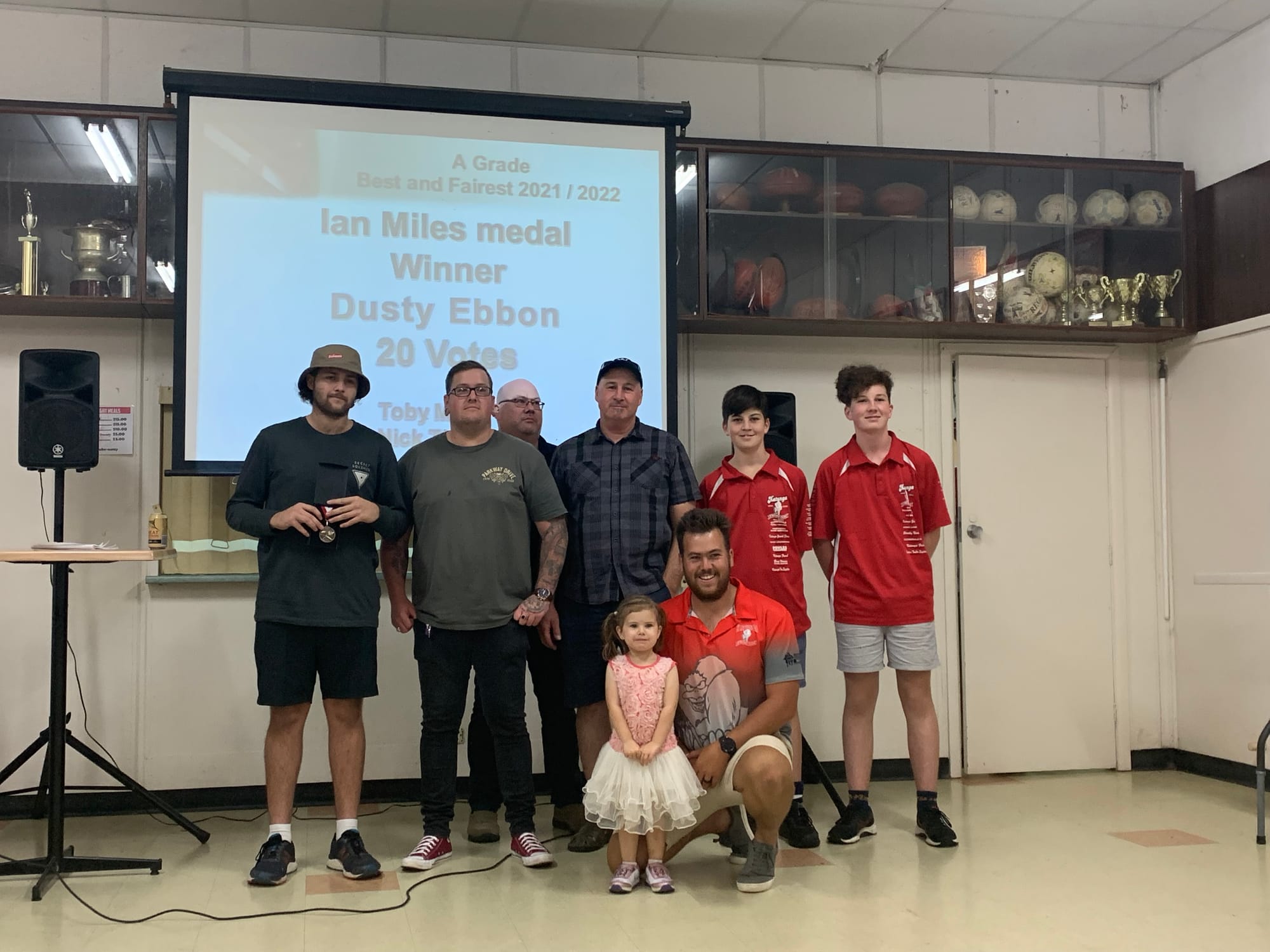 A-grade Ian Miles medallist... Dusty Ebborn (left) with extended Miles family presenting the Miles medal. 

