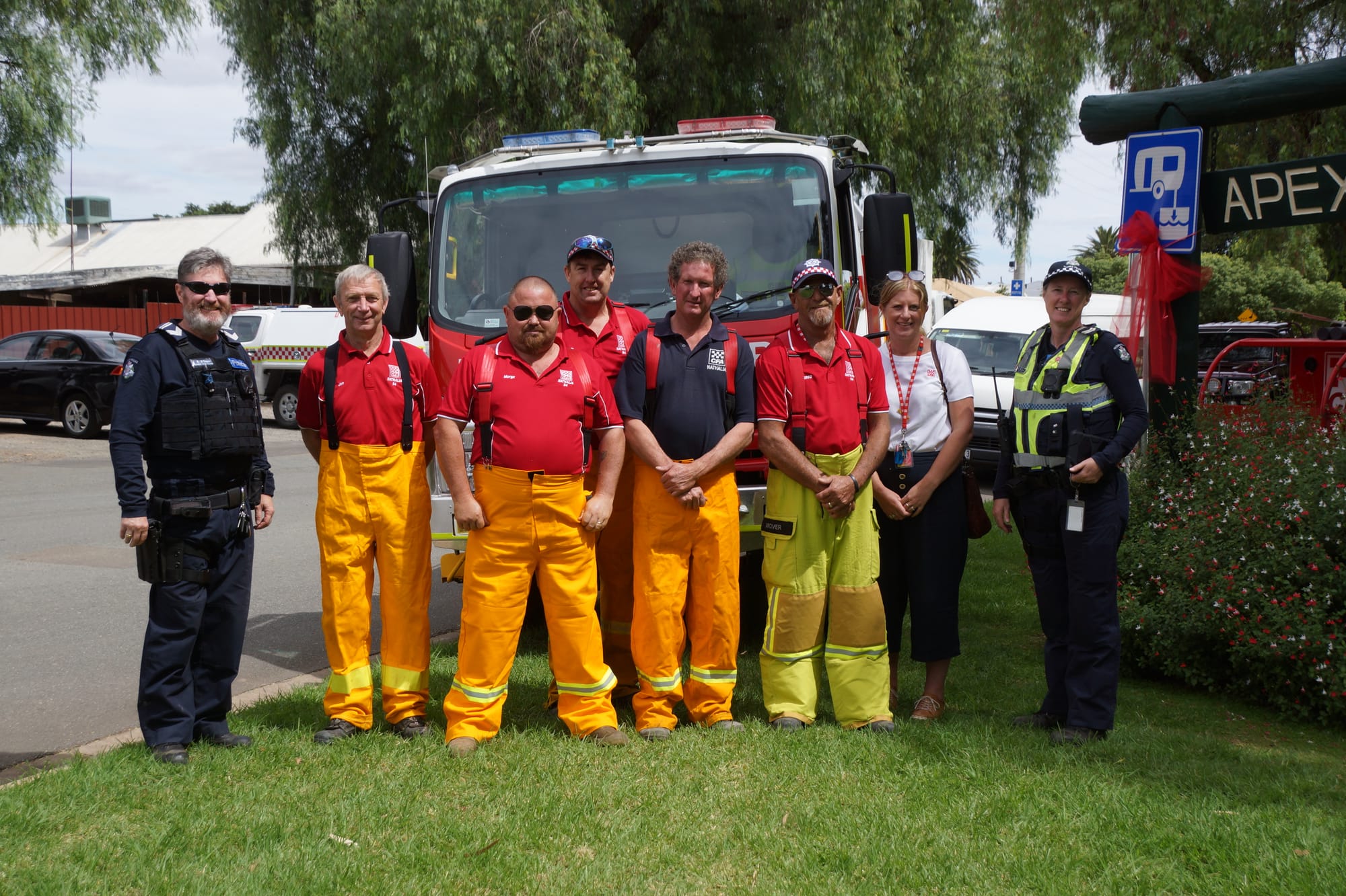 Emergency services ... (From left): Leading Senior Constable Bernie O’Dwyer, CFA volunteers Jon Barton, Darren Morgan, Scott Adams, Andrew Sessions, Greg McIver, CFA district 22 community engagement officer Emily Guthrie and Leading Senior Constable Kerrie-Anne Rappell happily joined in the festivities. 