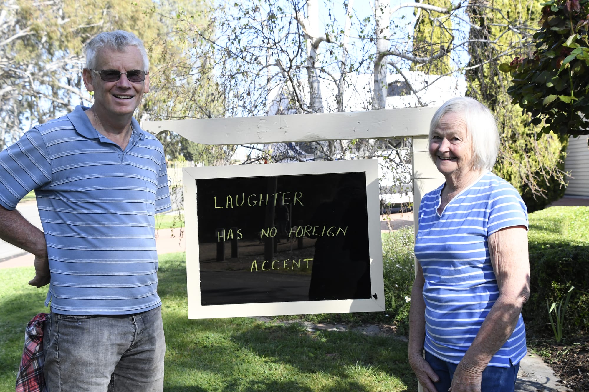 Sign of encouragement ... Barb and Garry Duke are pleased to be shining a small light into the darkness of lockdown. 
