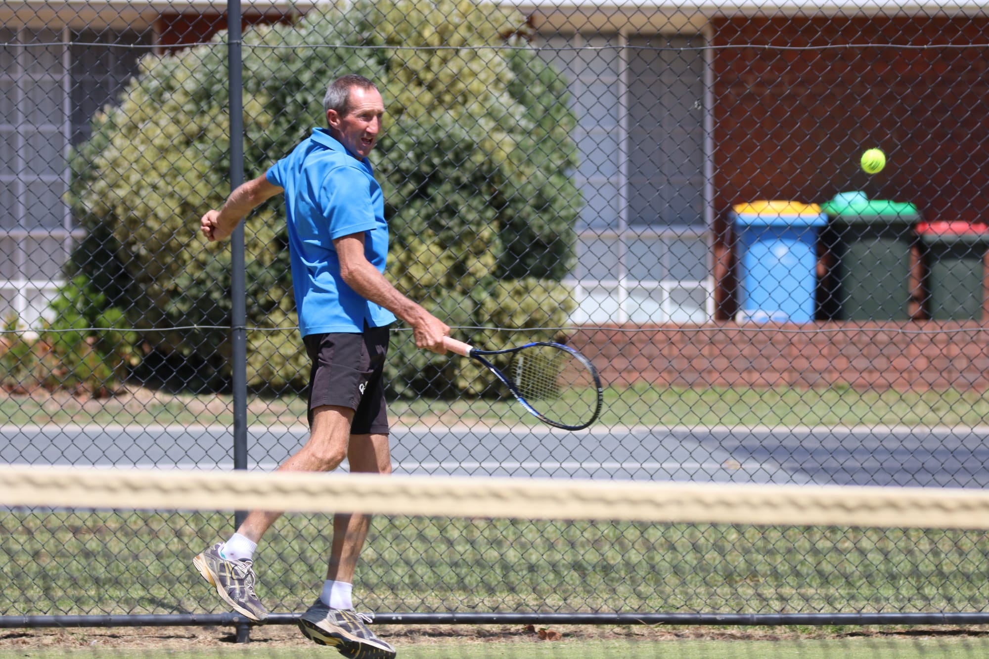 Jumping Jack ... Craig Brown shows his athleticism as he returns a ball down the court.