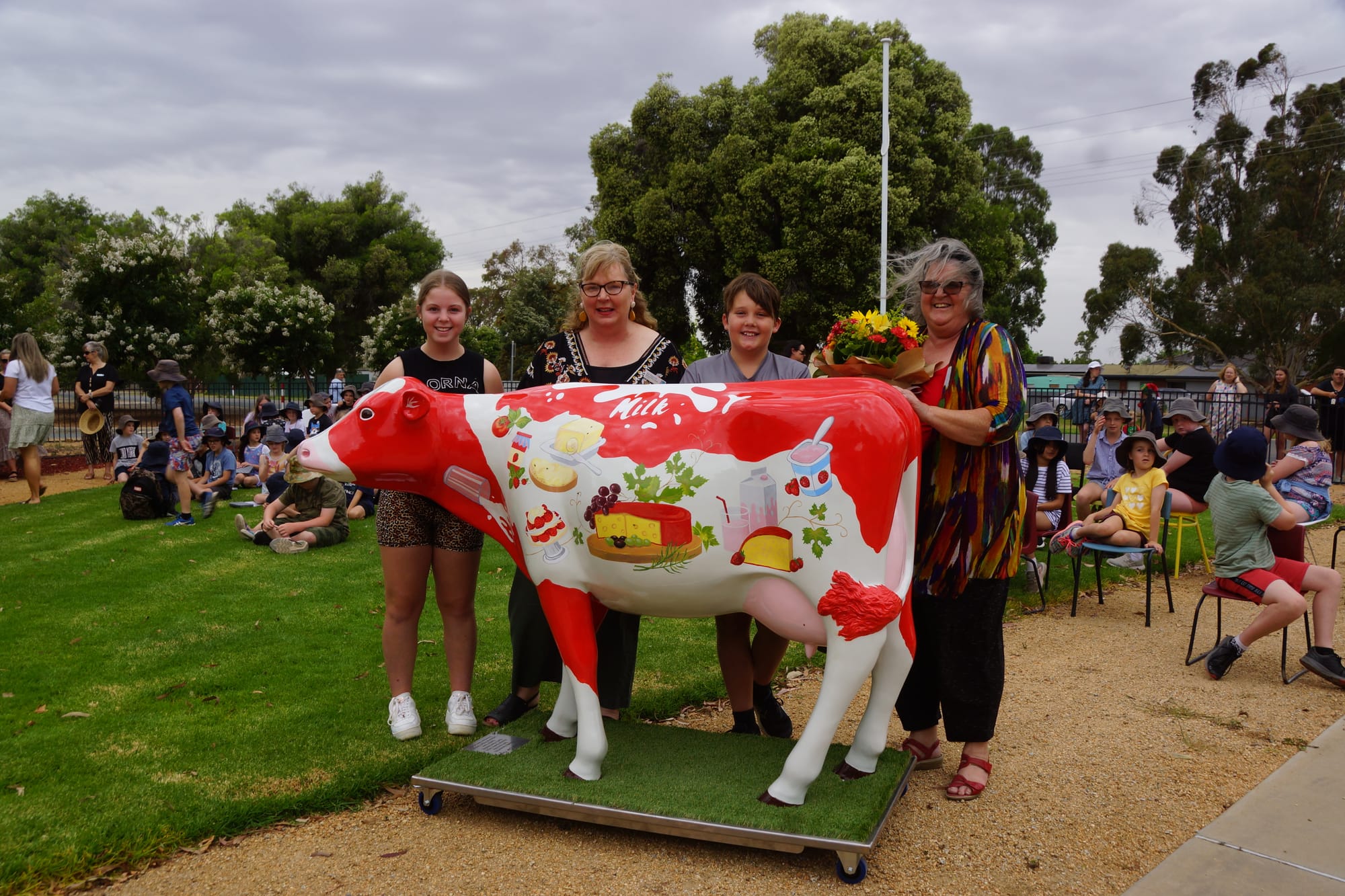 Finished product... School captains Ruby Hickey (left) and Koby Gilmour (second from right) with principal Nat Hopcroft (second from left), artist Rosslyn Rankin, and Swannie. 
