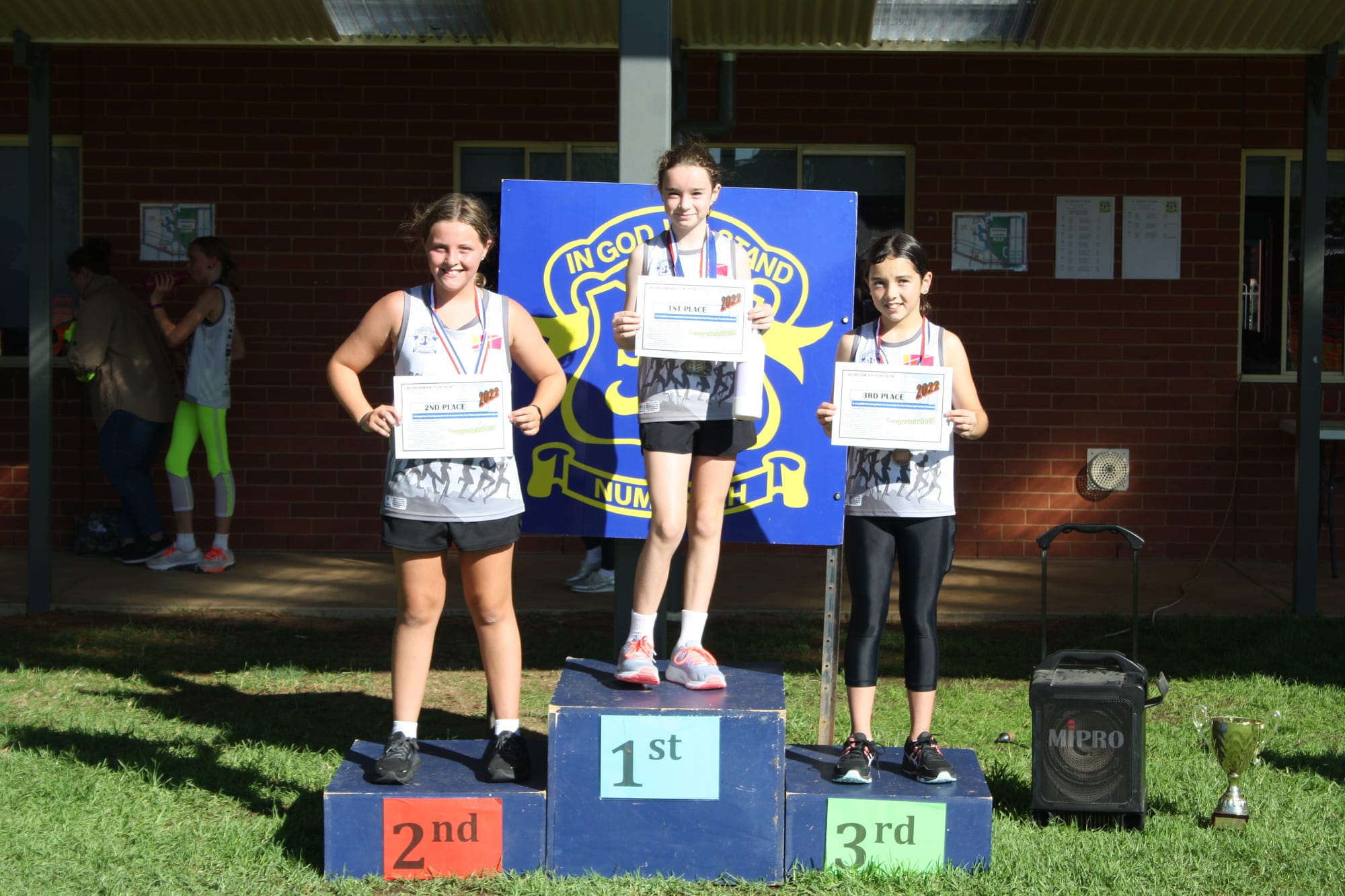 Go girls... (From left): Poppy Dobson, Eve Boase and Mia Weygood came in at the head of the primary aged girls 5km pack.
