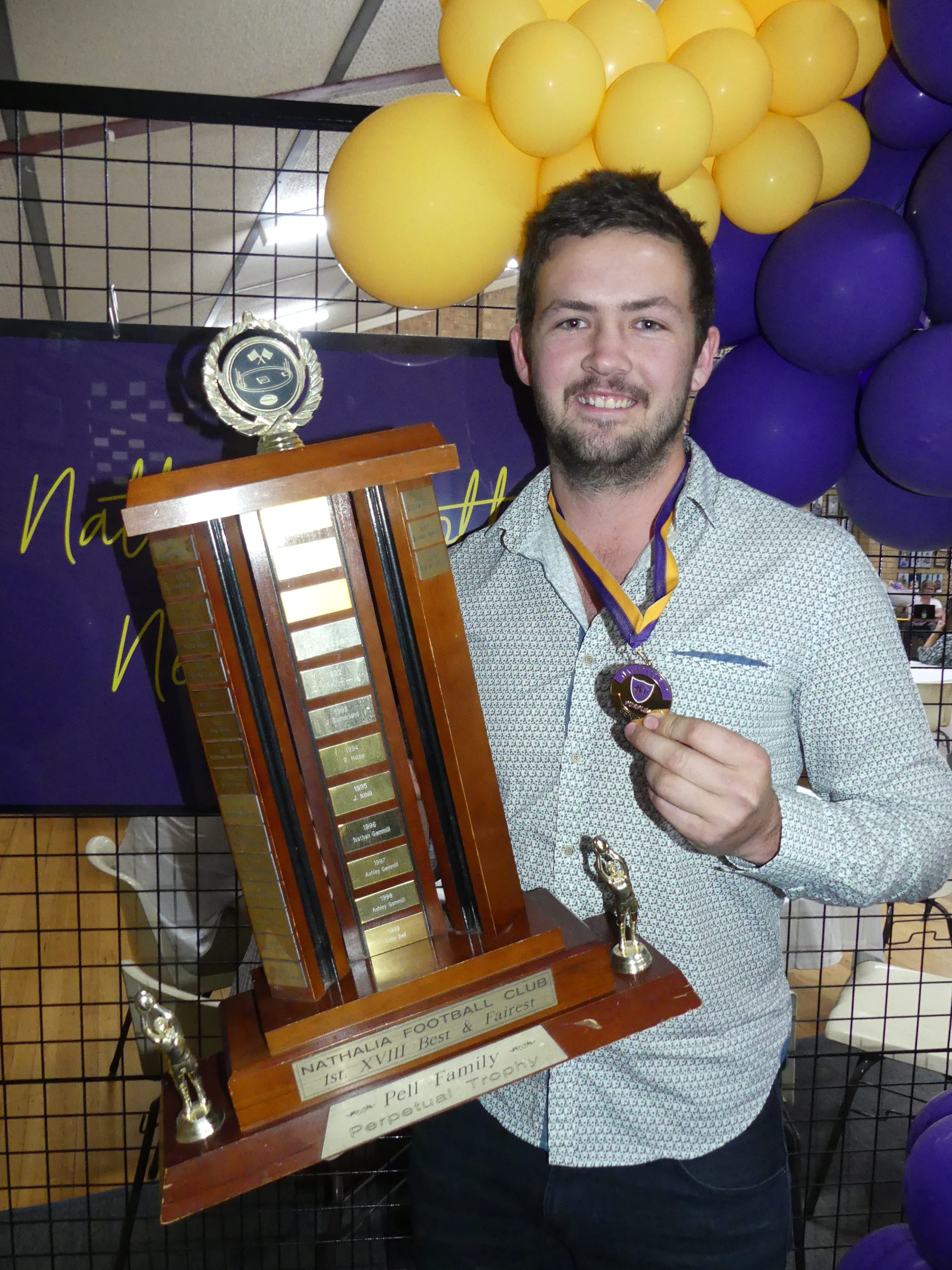 Winners are grinners … Nathalia best and fairest winner, Alex Hicks, with his awards.