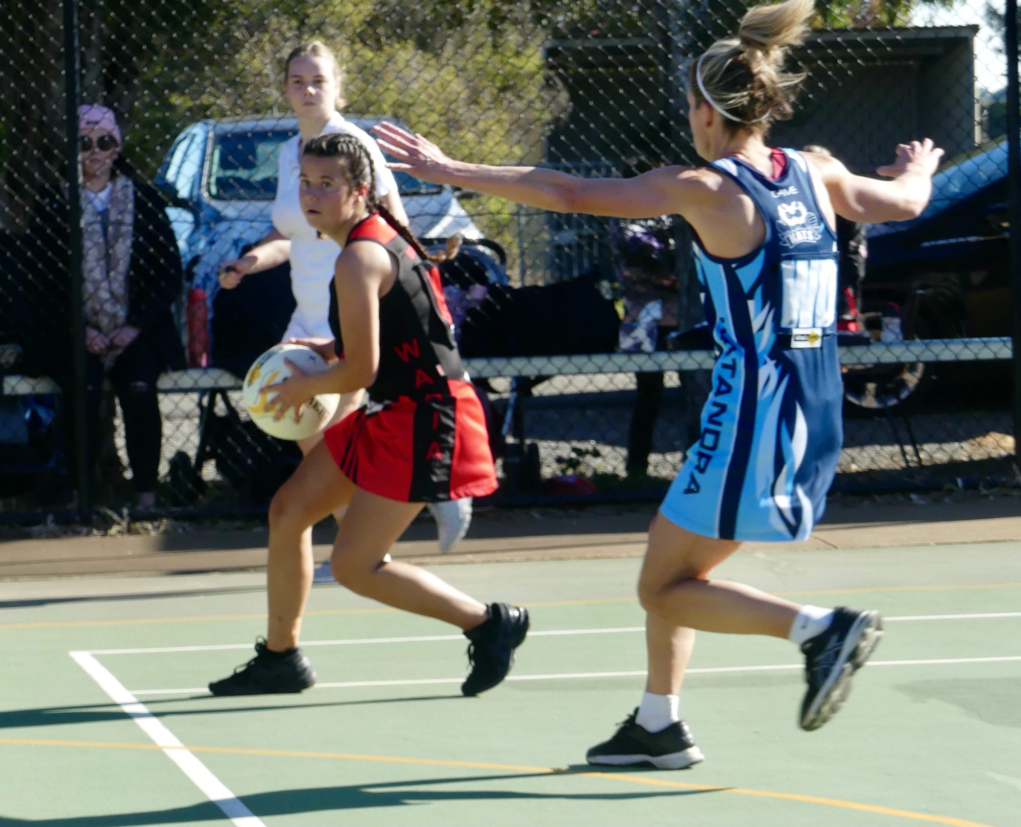 Tight-roping the boundary ... Eloise Walker looks for an option to pass to in the goal ring. 
