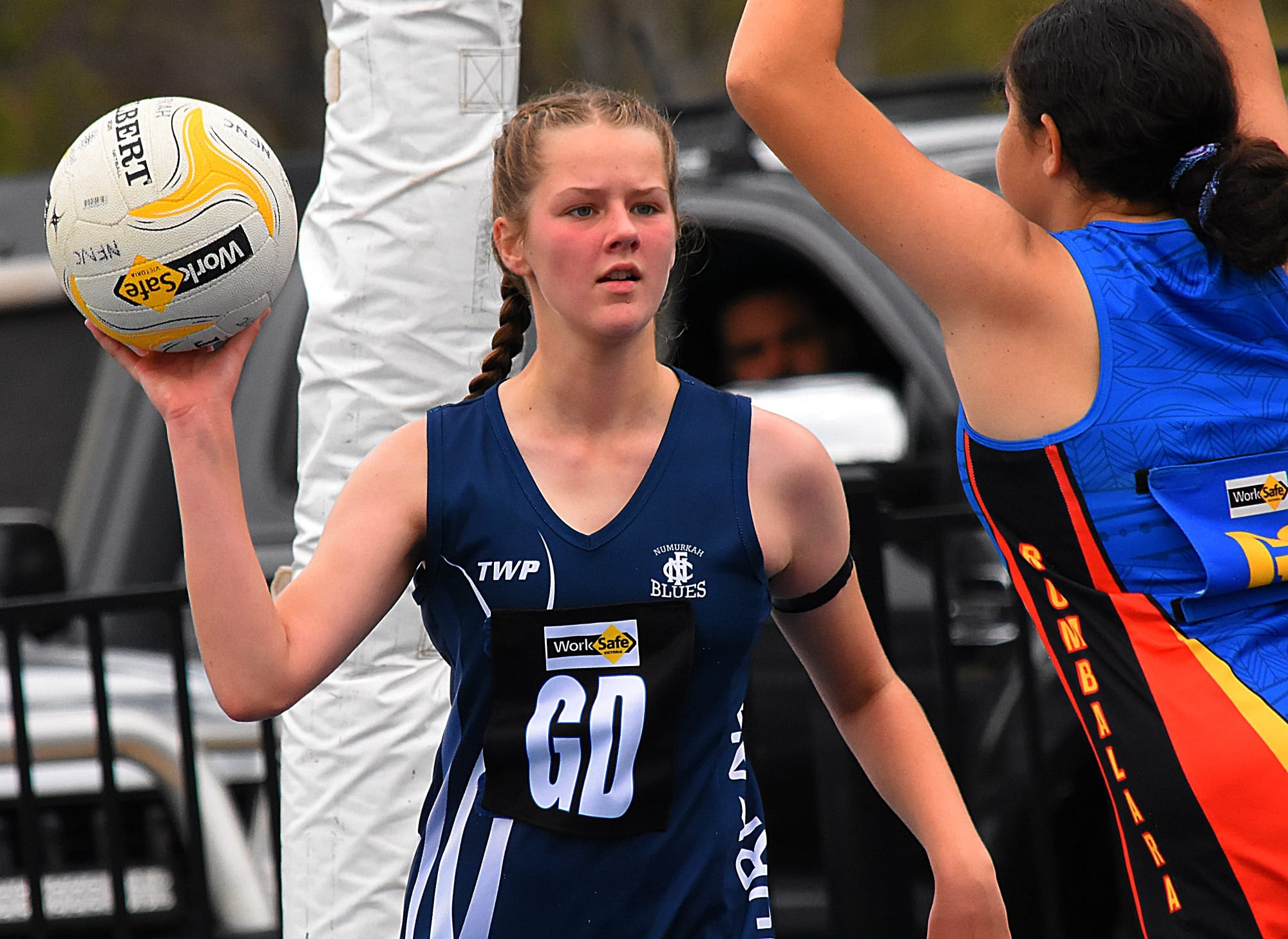 Under pressure... Ella Parkinson looks for a target in the under 13s. 