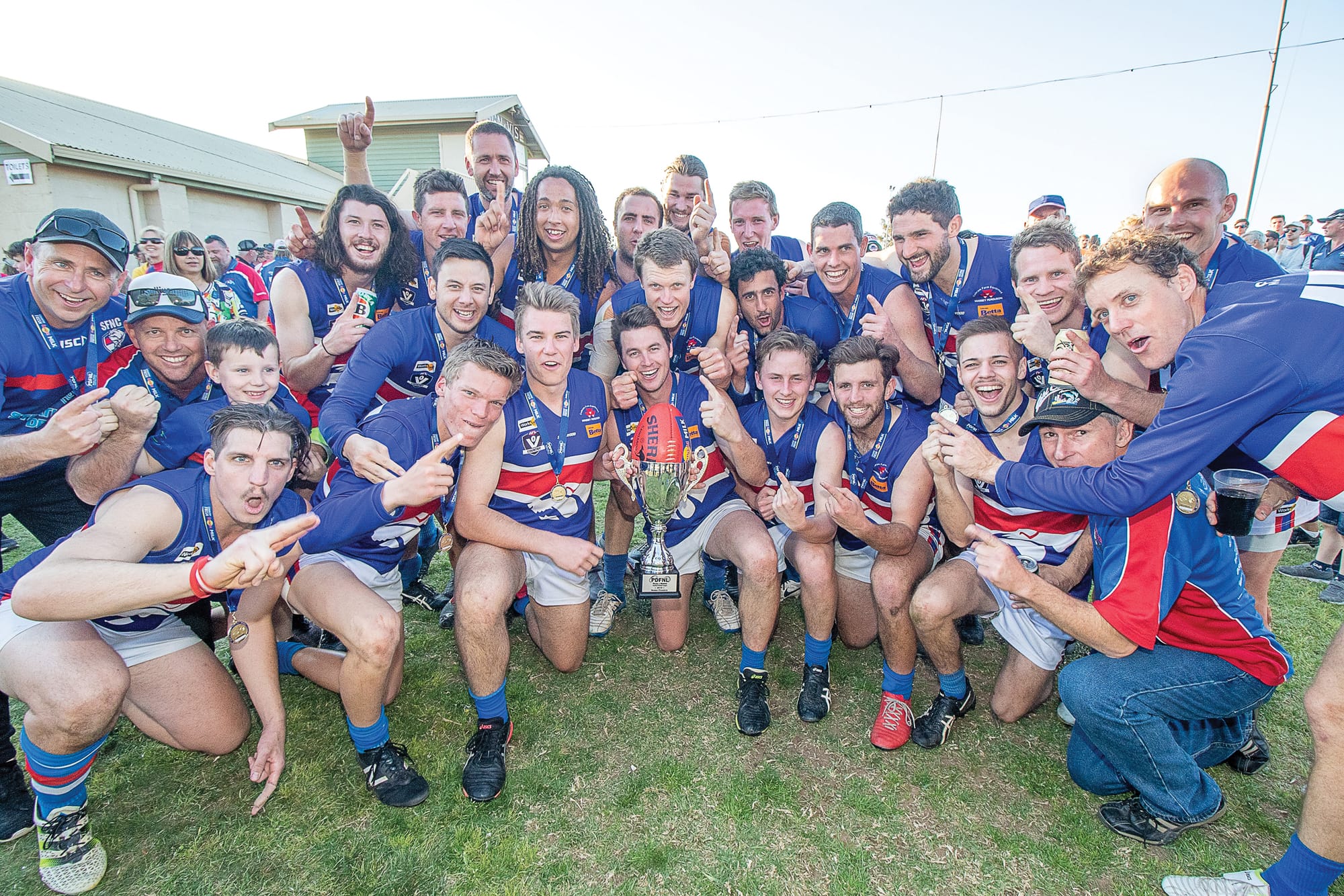 Celebrations begin … Strathmerton’s premiership players, coaches and officials celebrate their 2019 win.
Photo by Bruce McKean