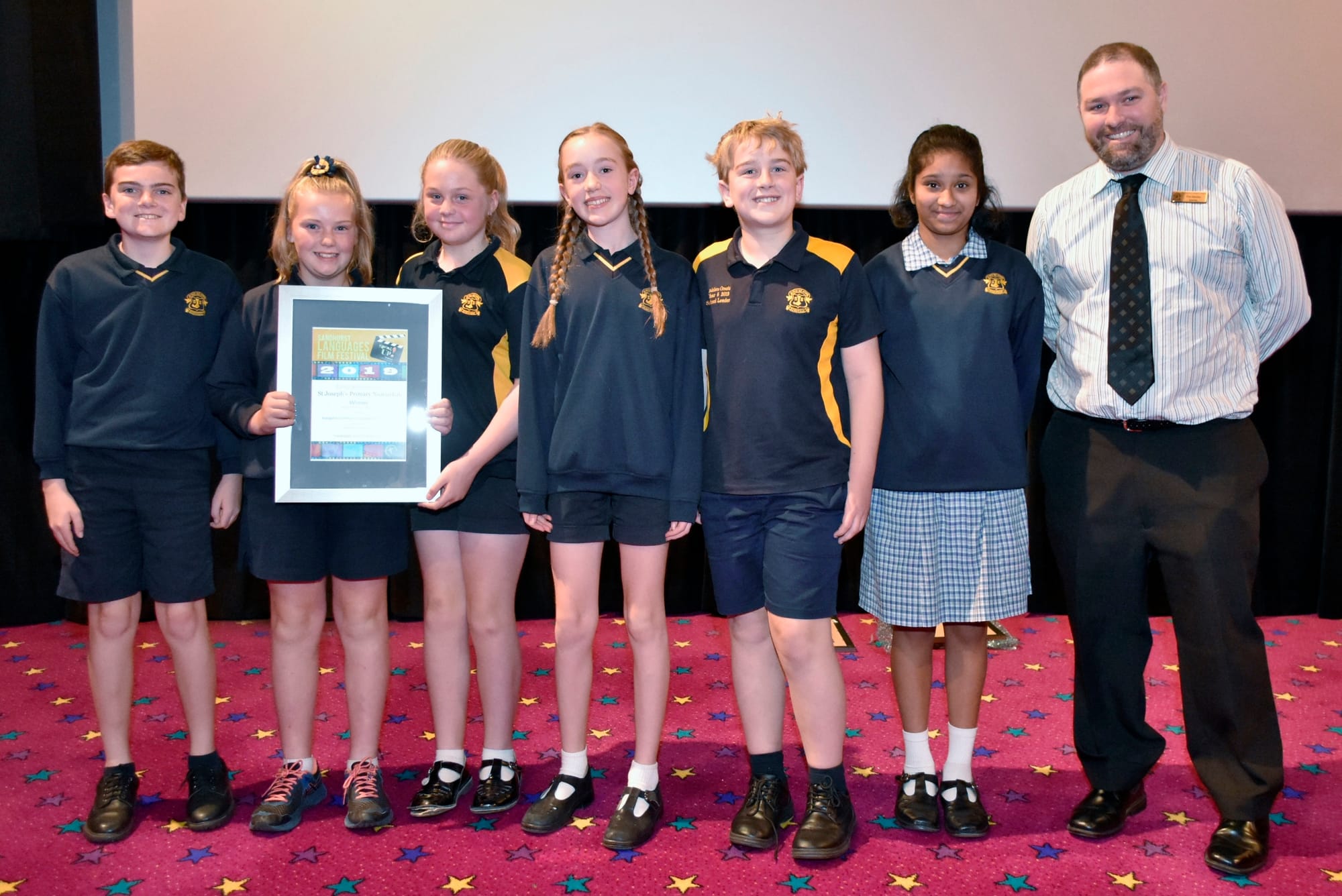 Winning film crew ... Darcy Edis, Rahni Lawless, Mia Duggan, Rebecca Retallick, Addison Oswald, Bavesha Krishnankutty and Mr Tim Harber beam with pride at their win.