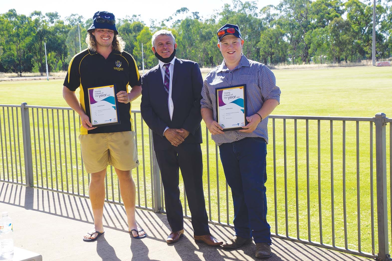 Fine young men... Joint winners of the Young Citizen of the Year award, Daniel Parnell and Lachlan Ross, pictured, from left, either side of mayor Libro Mustica, are both modest about the efforts that saw them receive the award.
