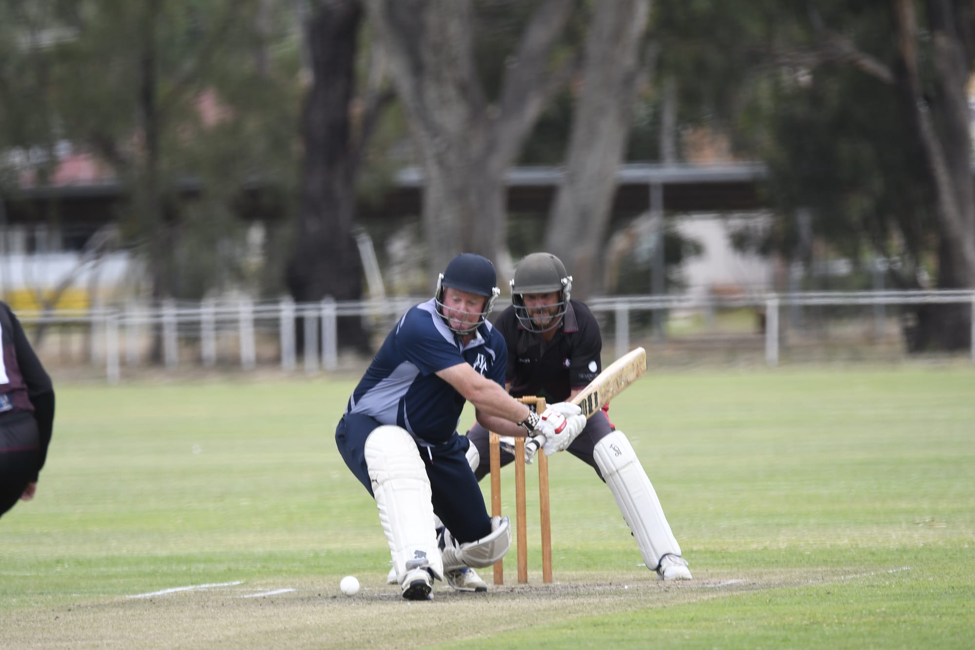 Whack... Blues B-grade skipper Sean Dawson loads up to play a slog sweep. (4694)
