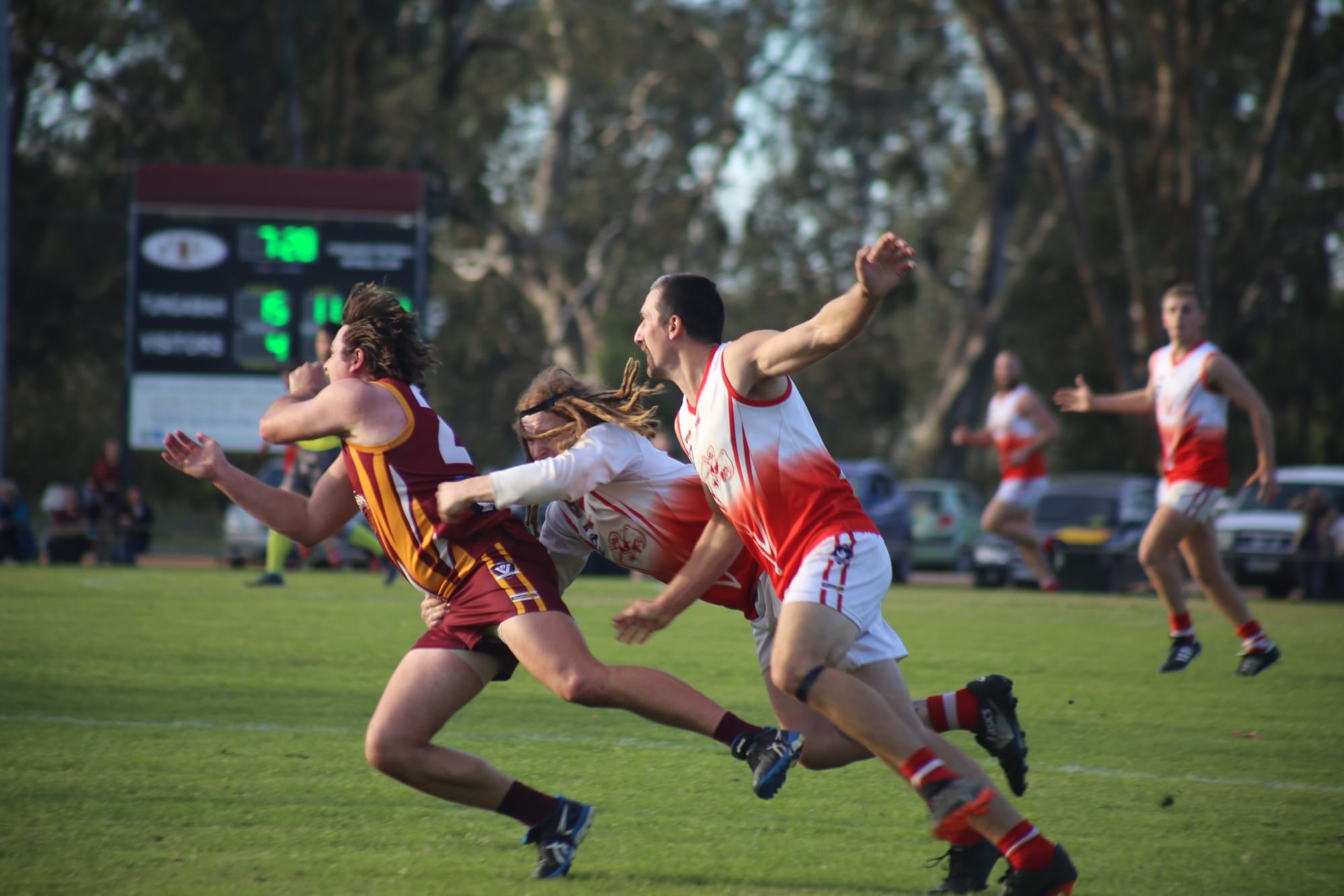Nearly... Harry Hill and Ethan Hodgkin both try to chase down a Bears player. 
