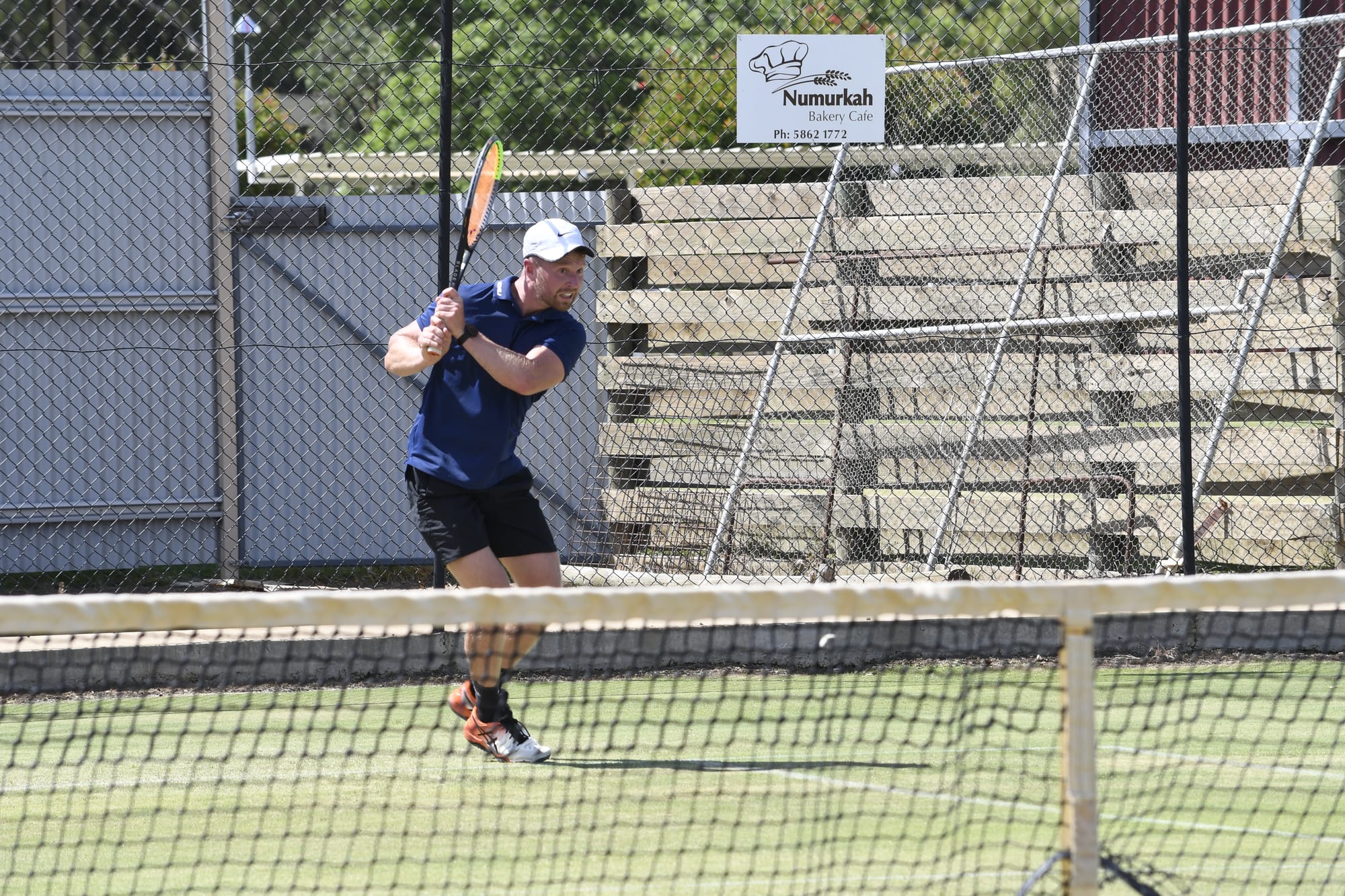 Shot... Nick Fenaughty hits a backhand.

