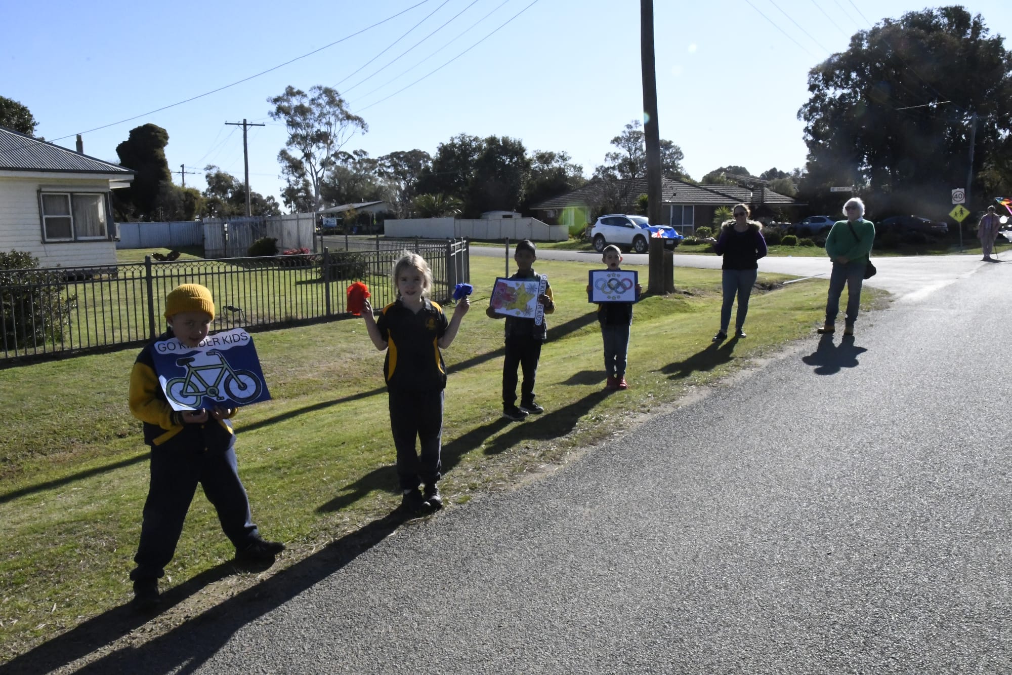 Cheer squad... Primary school kids, parents and grandparents lined Goorang Street to cheer the athletes on.