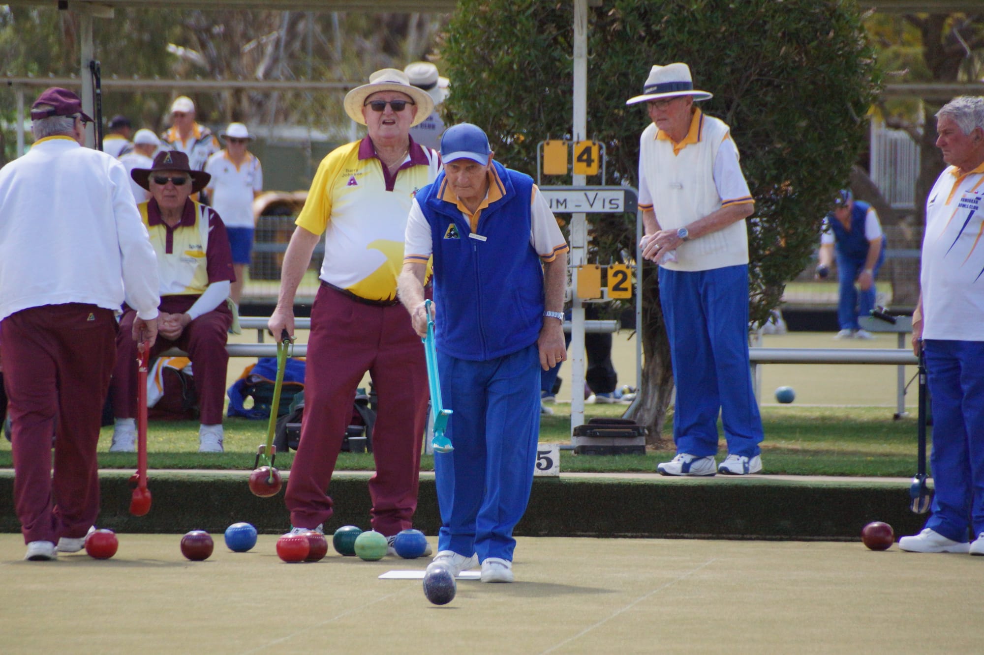 Doing their best ...Noel Boschetti sends down a bowl on Saturday.