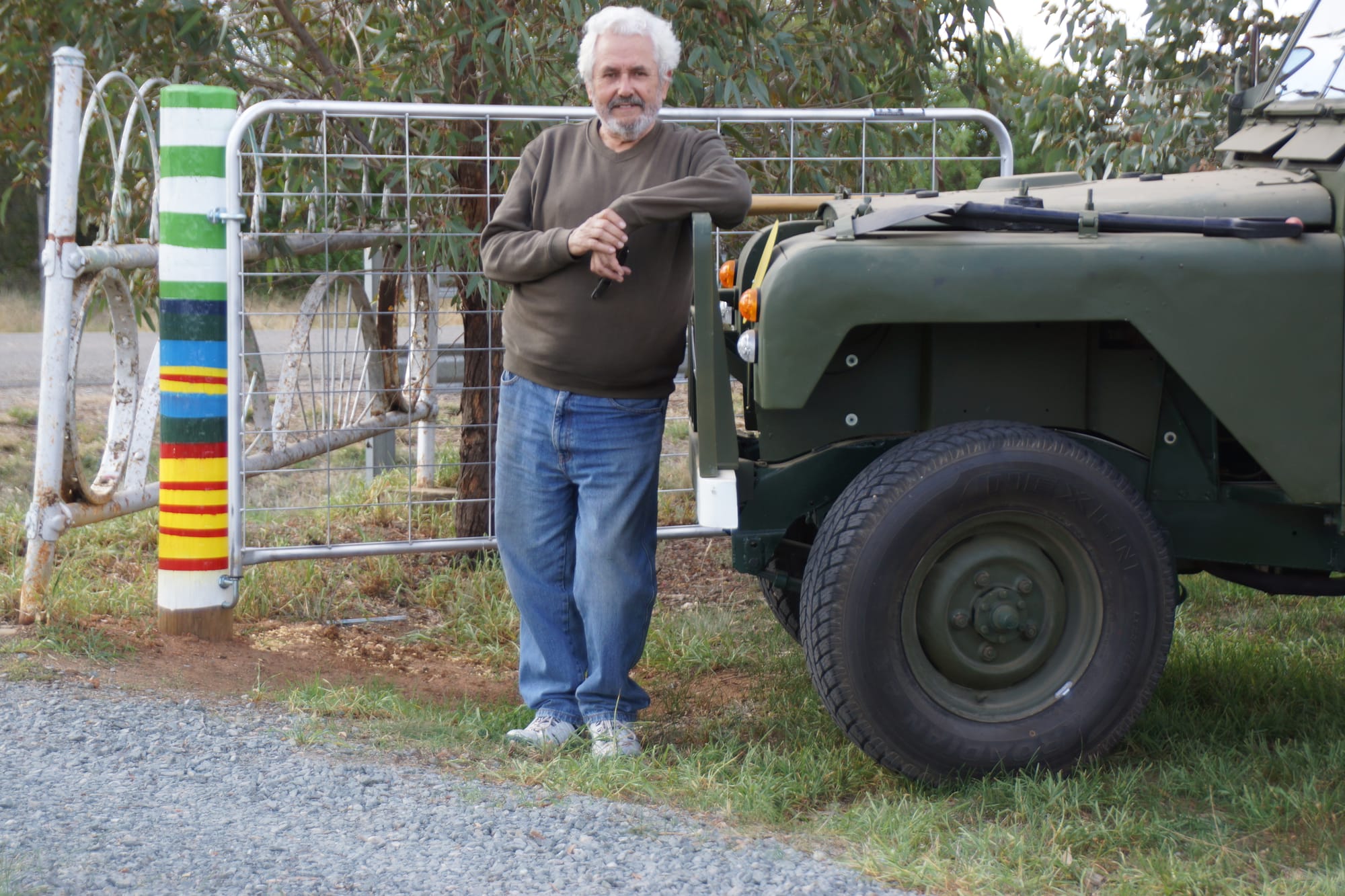 A Vietnam vet lives here ... Jeff Stanyer with his ‘military’ gates and a former army jeep he rebuilt from the ground up.