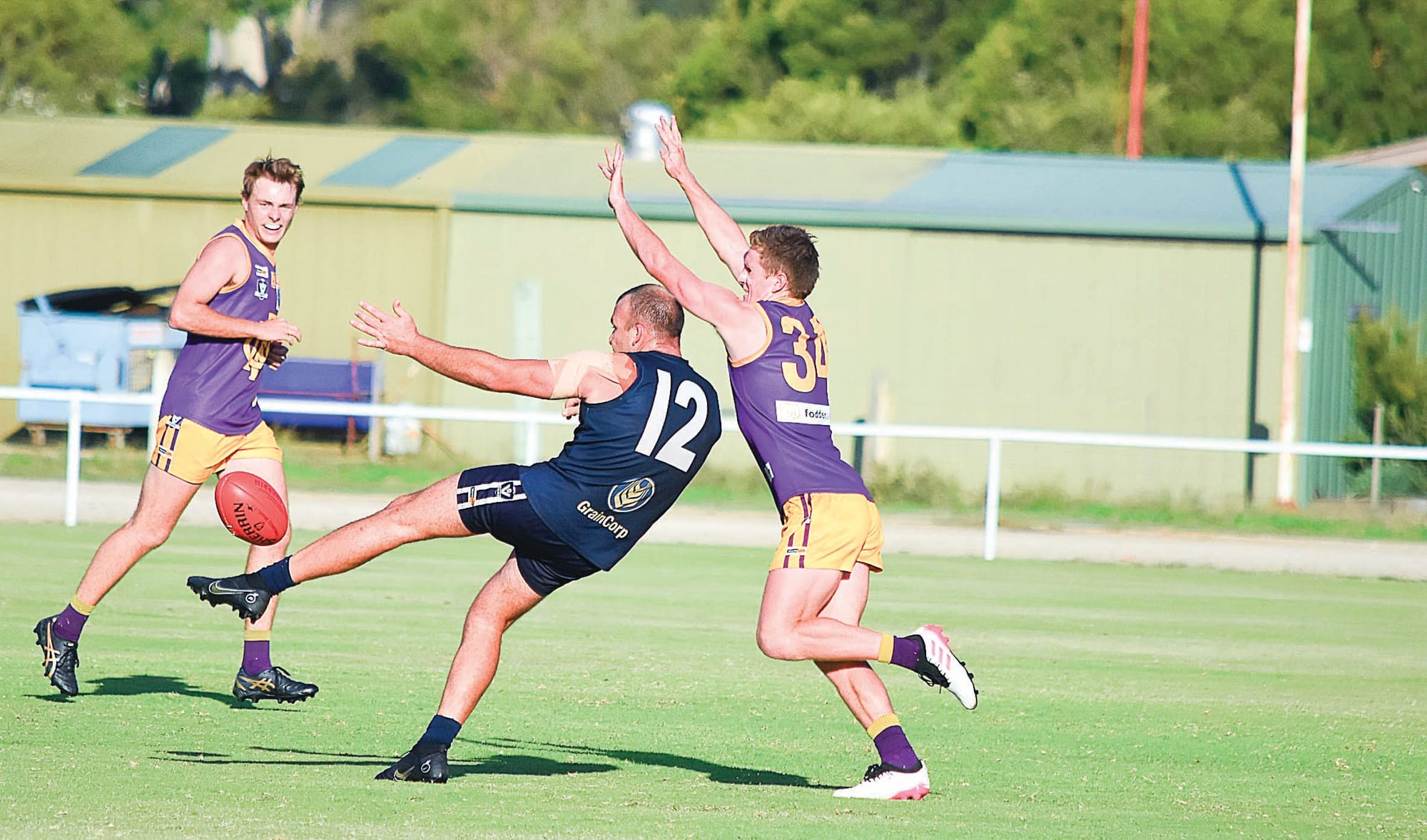 Star veteran... Nathan Hicks snaps one of his four goals around his body, under pressure from Clancy Congues. 