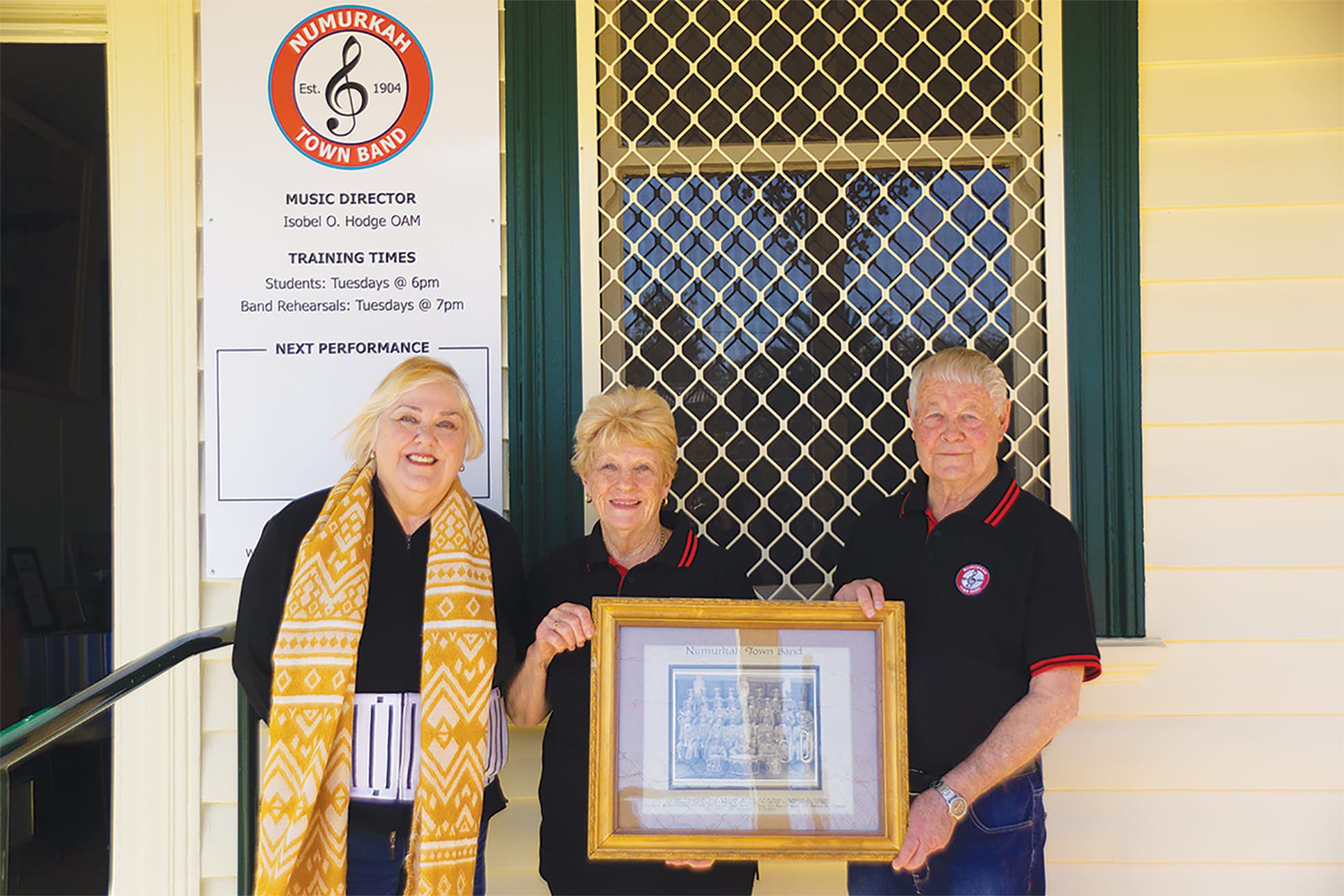 Looking good ... Band members Marie Martin and Dorothy and Peter Heard celebrate the
band’s history, and future, outside the newly renovated band hall.