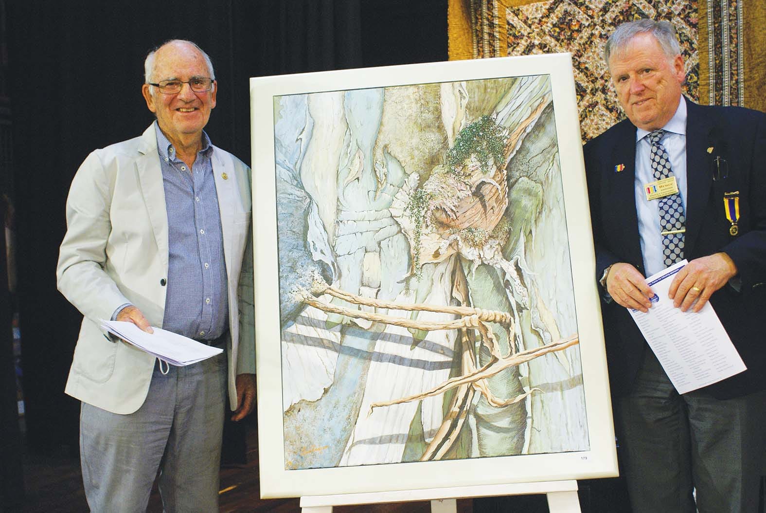 Best in Show...Art judge Geoff Paynter and Rotary District Governor Bruce Anderson with  ‘Jukaliatas’ by Mulwala artist Tim Redfern, which was awarded best in show.
