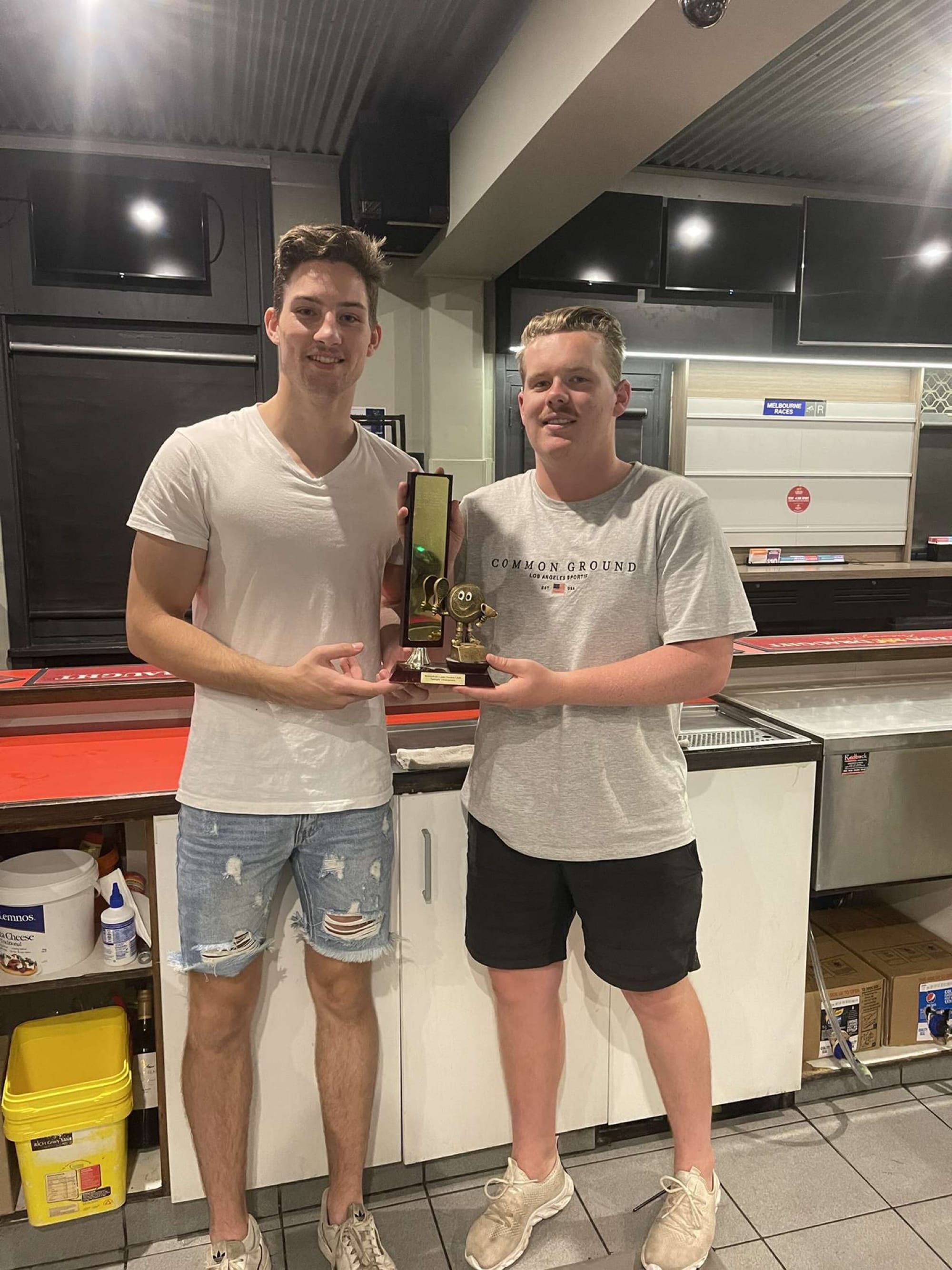 Claiming the win... Jarrod Holmes (left) and Zach McKeown eventually got their hands on the trophy. 
