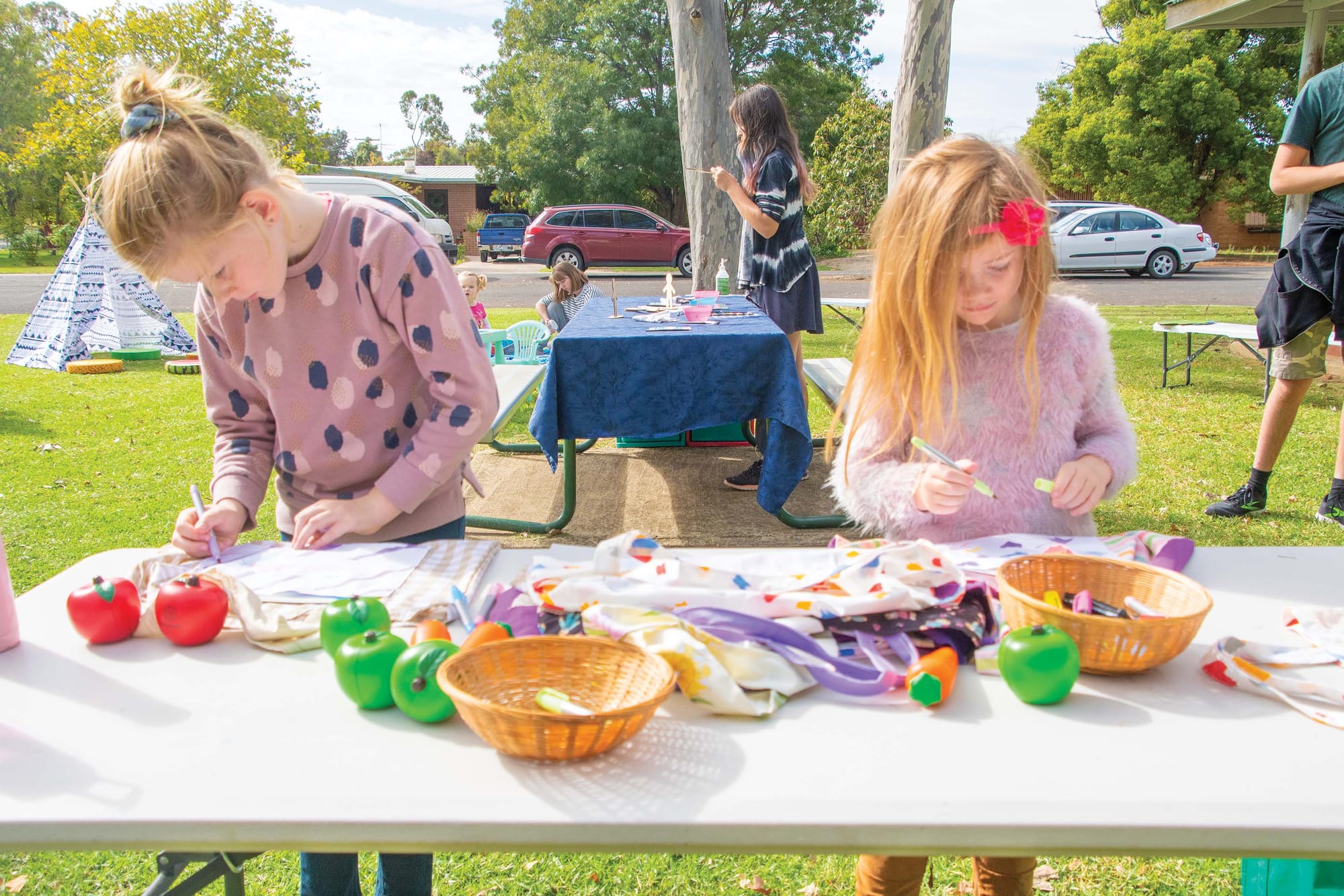 Creative minds ... Isabella and Eliza Razga had a great time making their bags look nice. 
