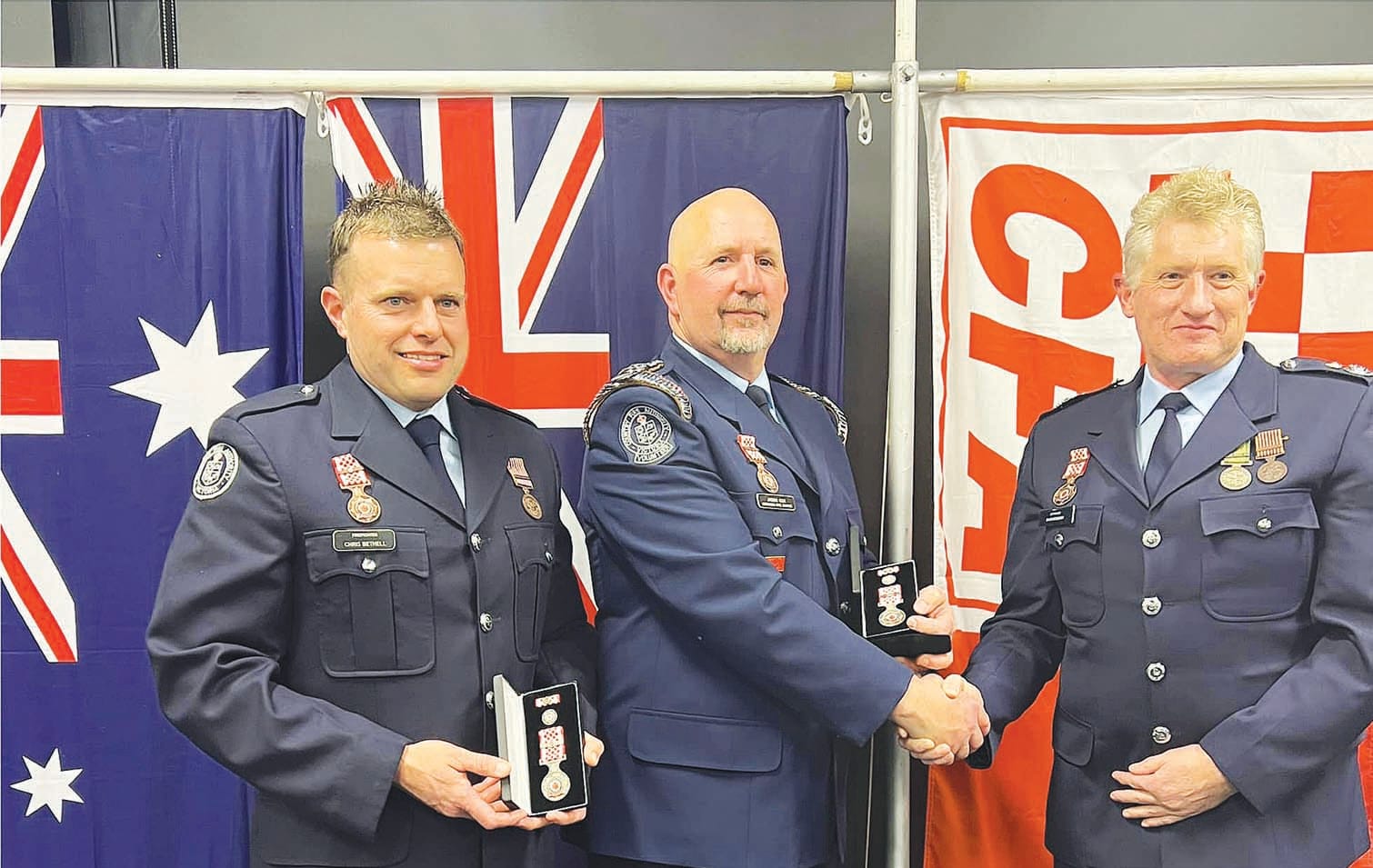Life members... (From left):  Health and Safety Officer Chris Bethell and Captain Jason Cox being presented with their life memberships by Commander Charlie Cleary.
