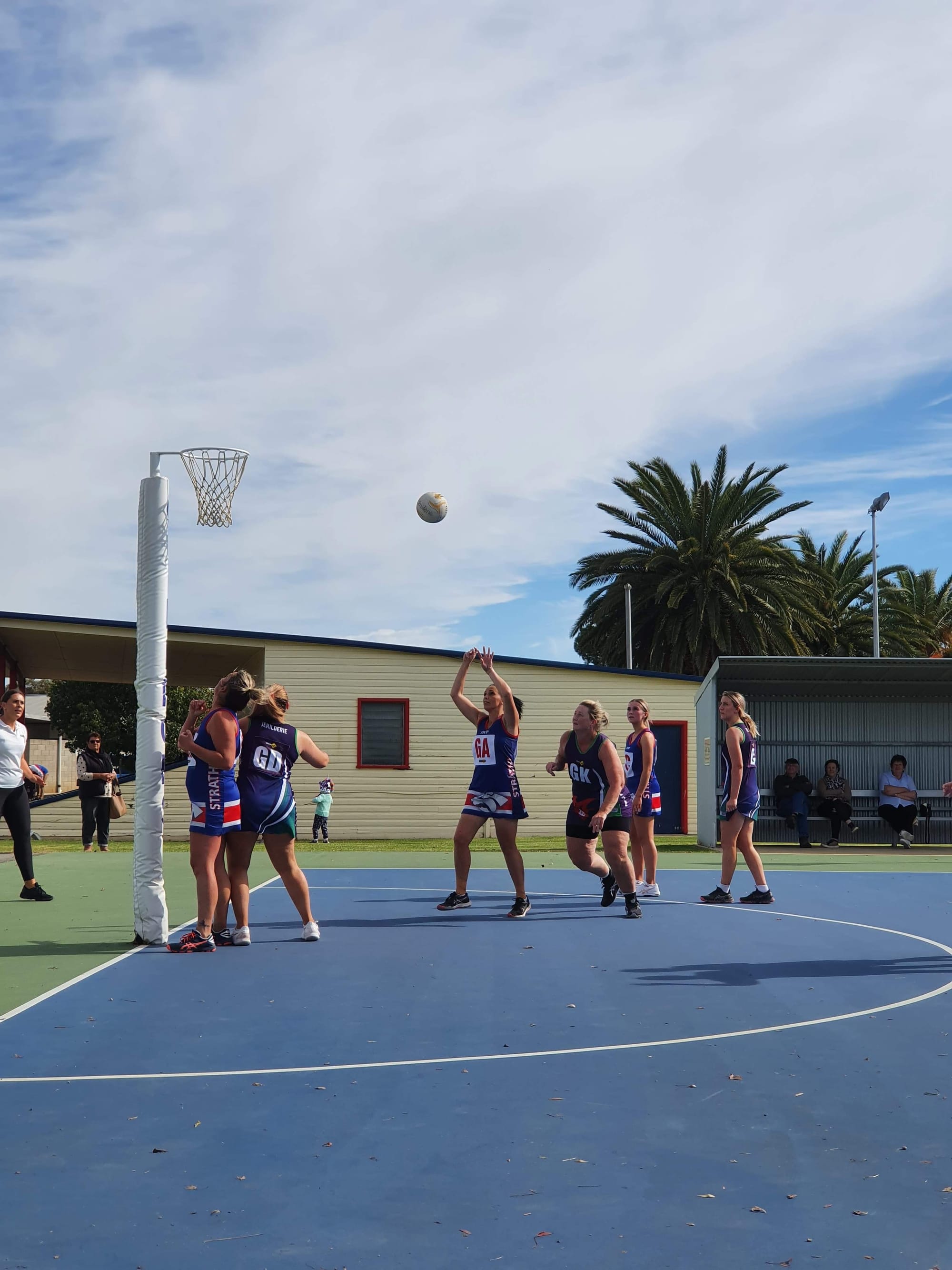 Put it up... Caitlin Mills shoots for goal in B-grade with Ash Palmer waiting under the ring.
